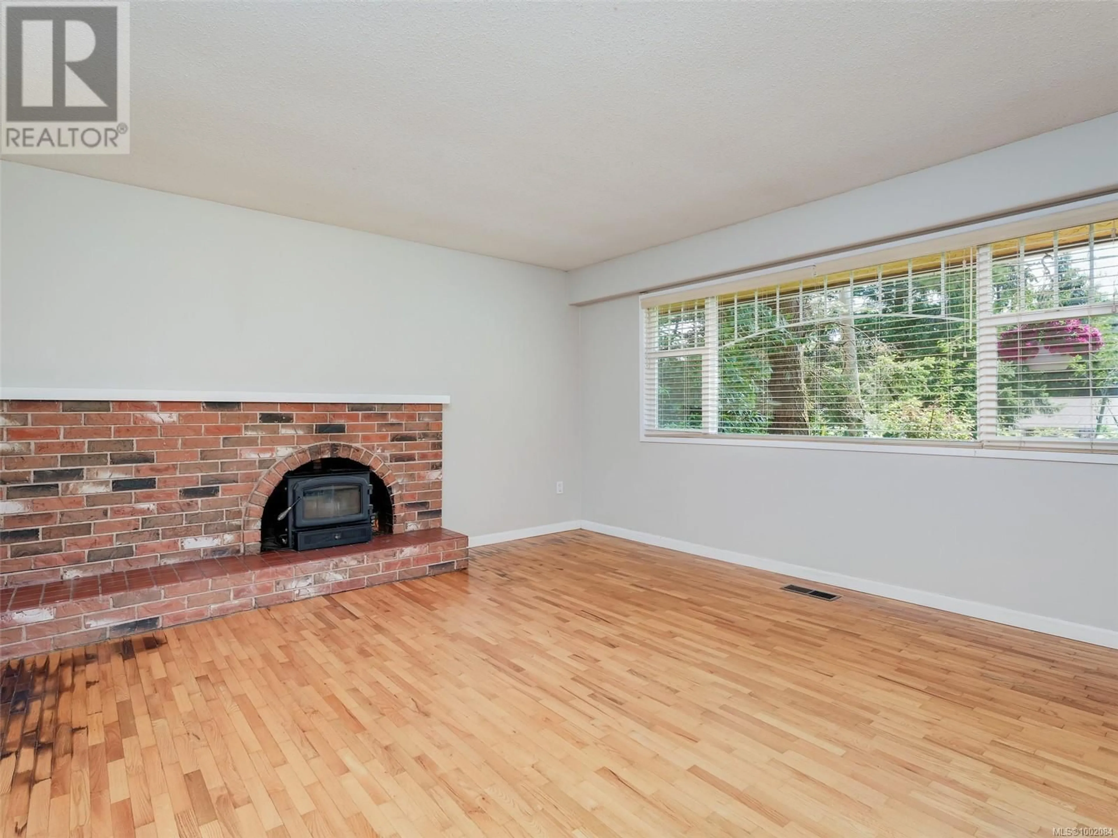 Living room with furniture, wood/laminate floor for 111 MARLER DRIVE, View Royal British Columbia V9B6B7