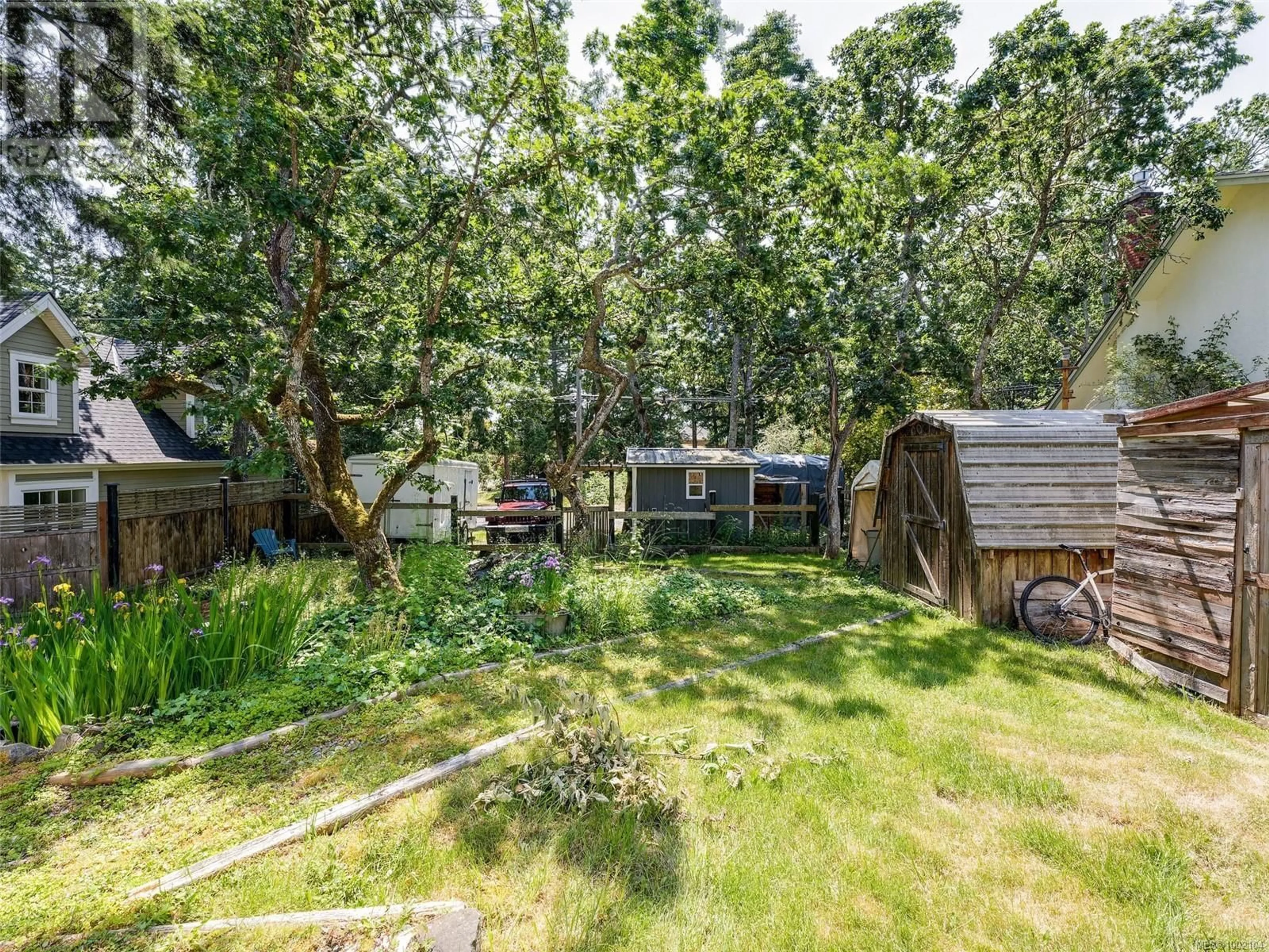 A pic from outside/outdoor area/front of a property/back of a property/a pic from drone, forest/trees view for 2784 TUDOR AVENUE, Saanich British Columbia V8N1L7