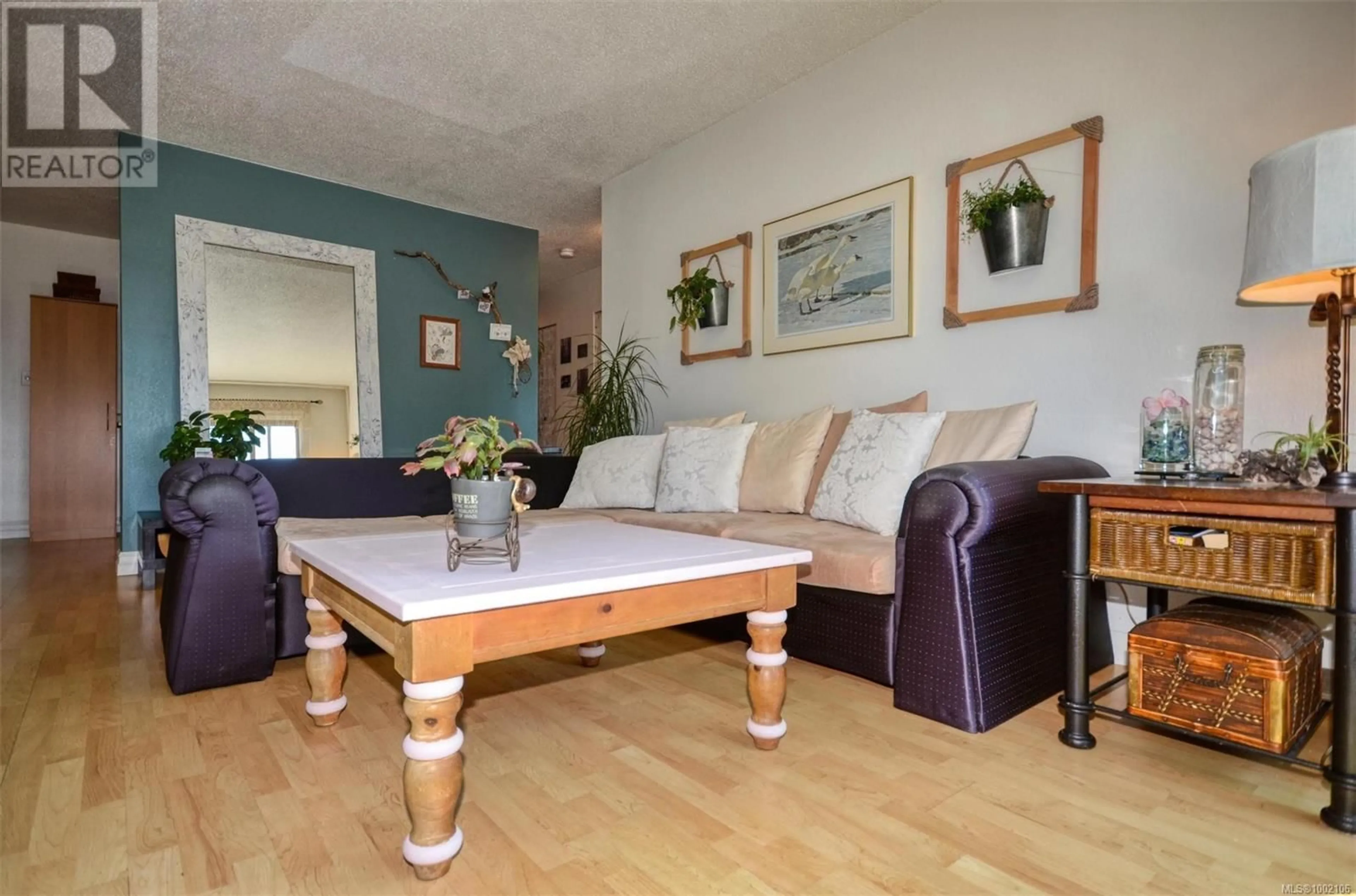 Living room with furniture, wood/laminate floor for 303 - 2427 AMHERST AVENUE, Sidney British Columbia V8L2H1