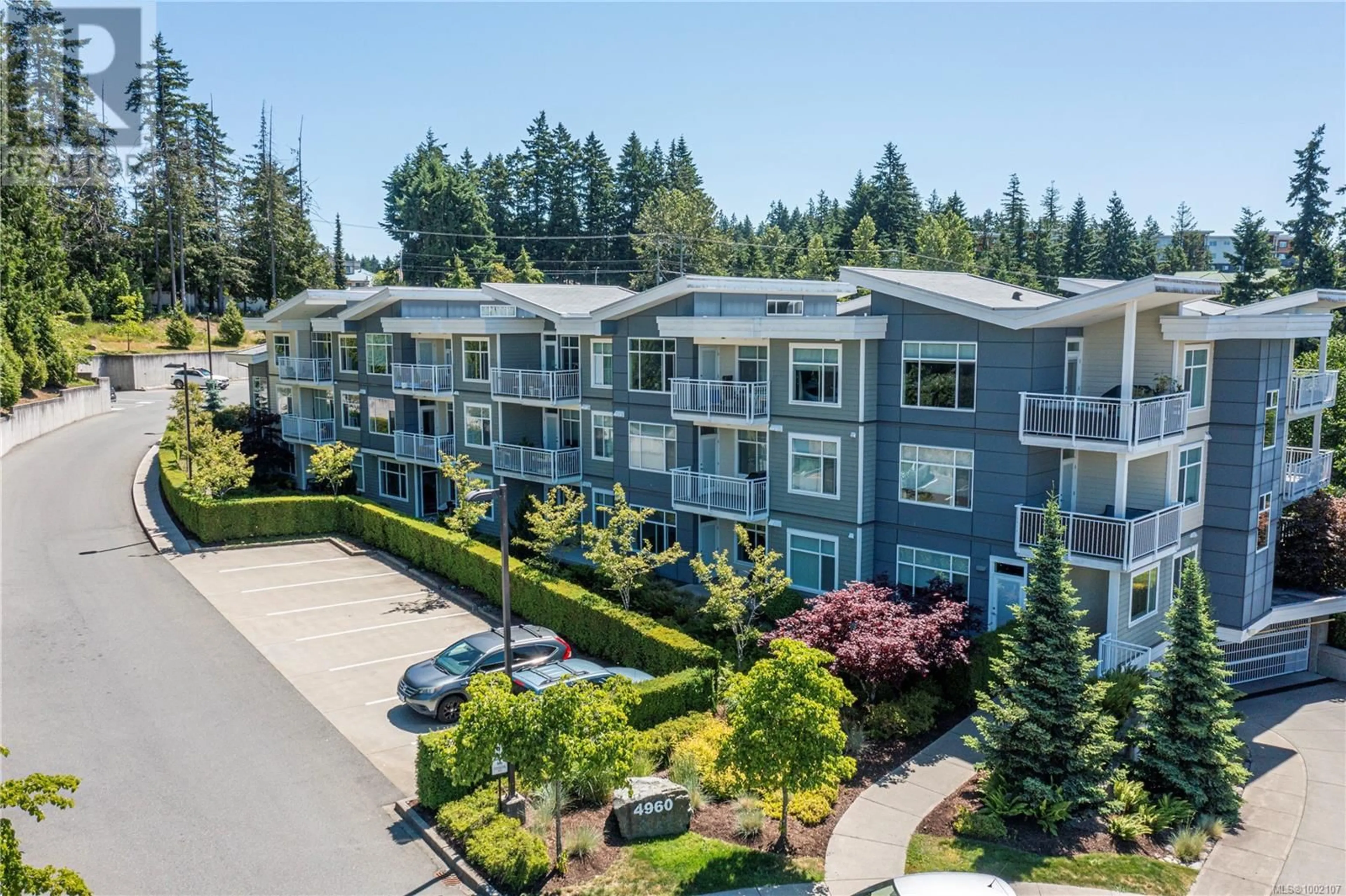 A pic from outside/outdoor area/front of a property/back of a property/a pic from drone, unknown for 104 - 4960 SONGBIRD PLACE, Nanaimo British Columbia V9T0H7