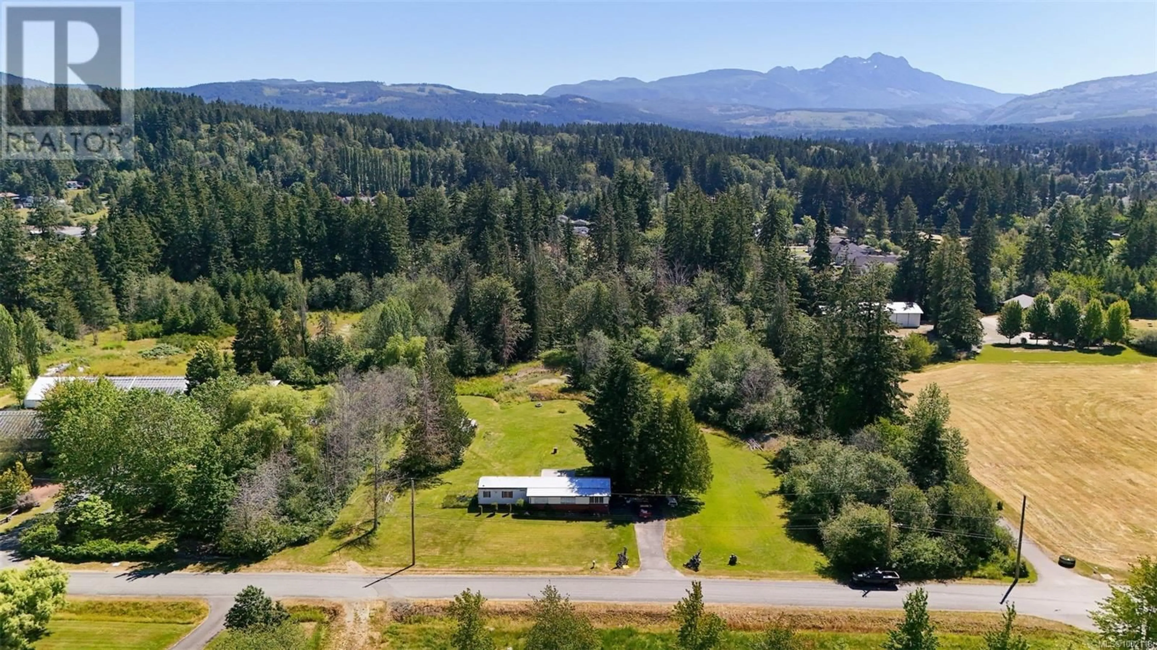 A pic from outside/outdoor area/front of a property/back of a property/a pic from drone, mountain view for 5611 STRICK ROAD, Port Alberni British Columbia V9Y8W4