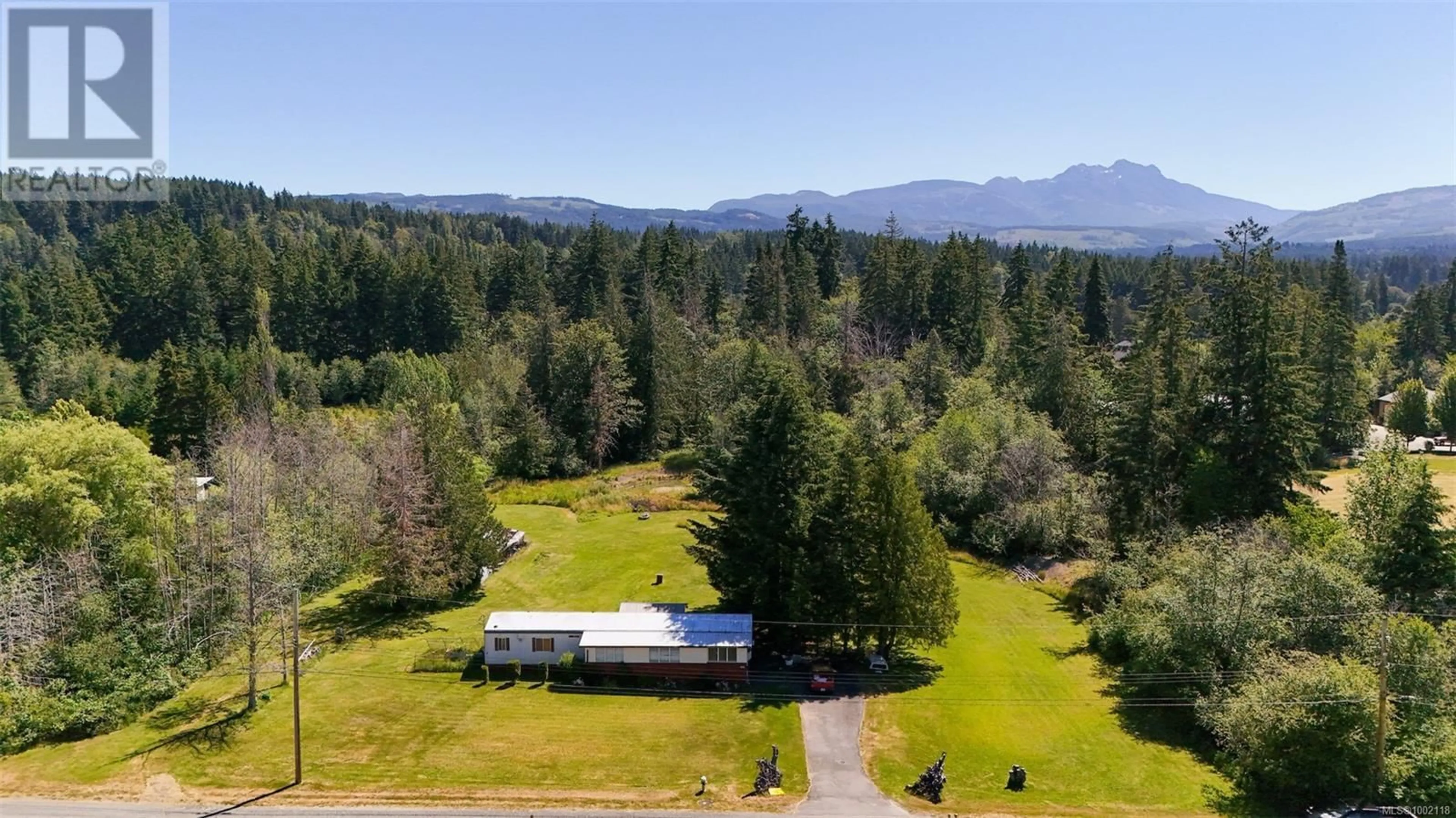 A pic from outside/outdoor area/front of a property/back of a property/a pic from drone, mountain view for 5611 STRICK ROAD, Port Alberni British Columbia V9Y8W4