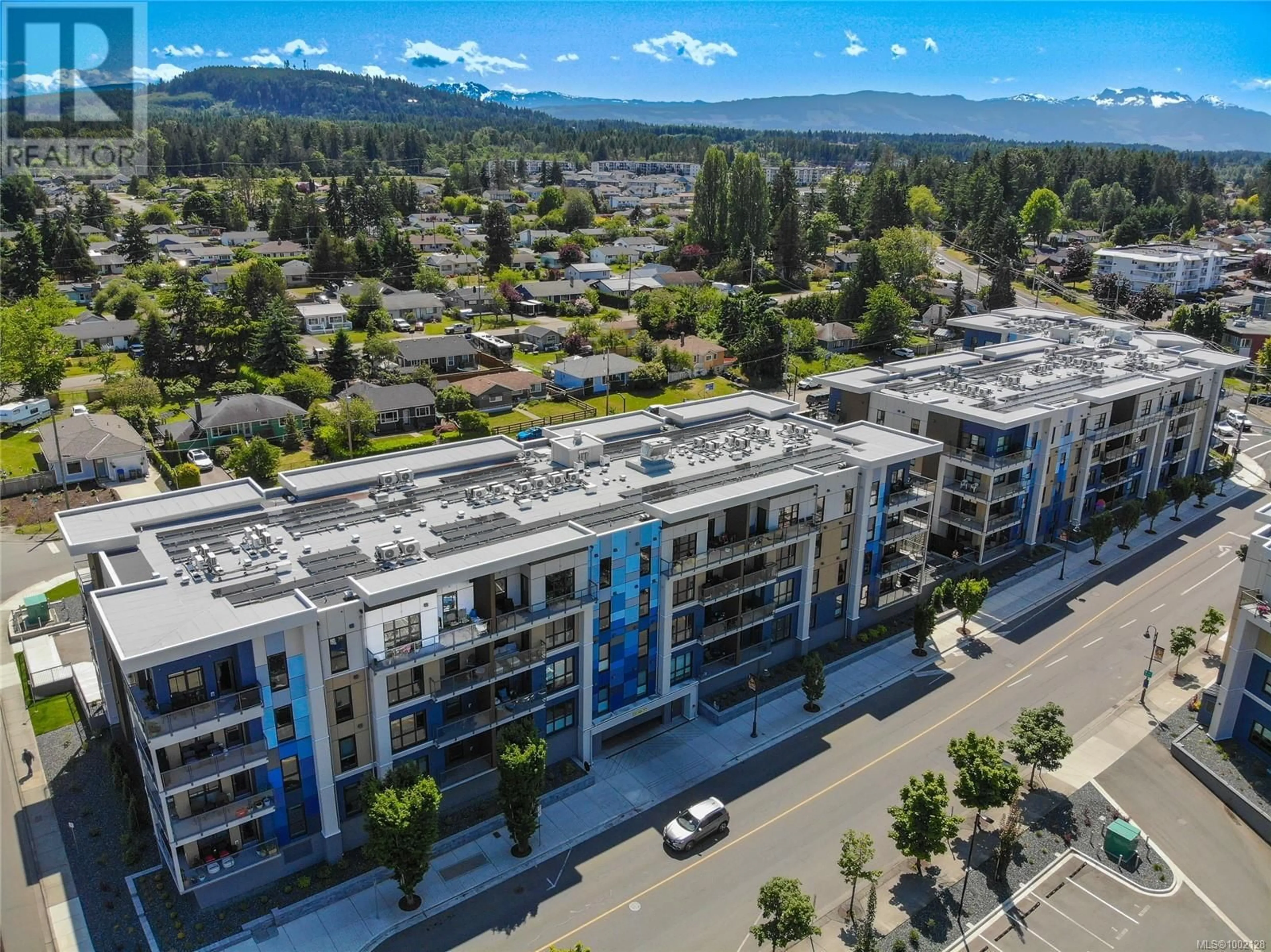 A pic from outside/outdoor area/front of a property/back of a property/a pic from drone, city buildings view from balcony for 409 - 120 JENSEN AVENUE, Parksville British Columbia V9P0H6