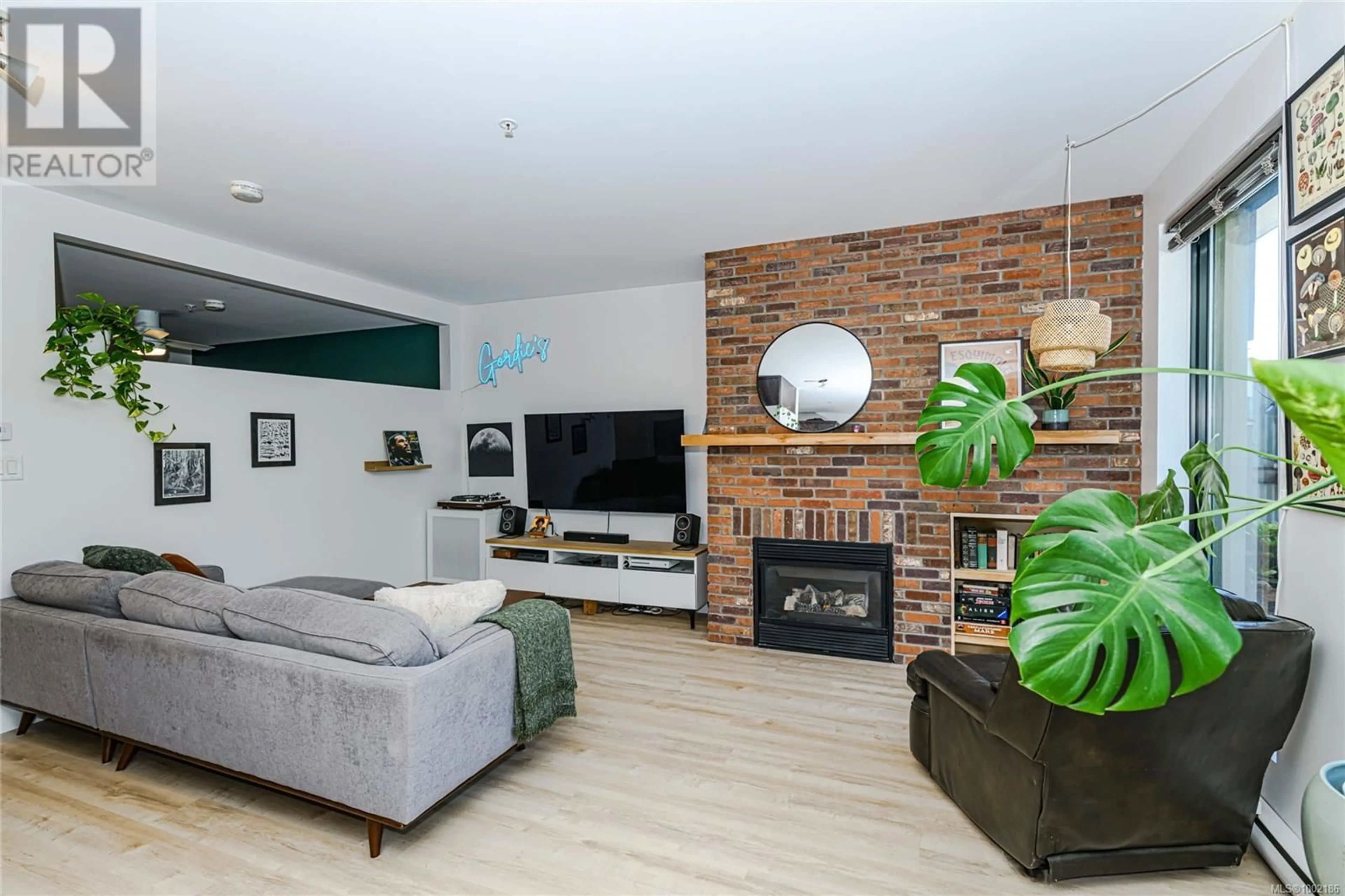 Living room with furniture, wood/laminate floor for 104 - 400 SITKUM ROAD, Victoria British Columbia V9A7G6