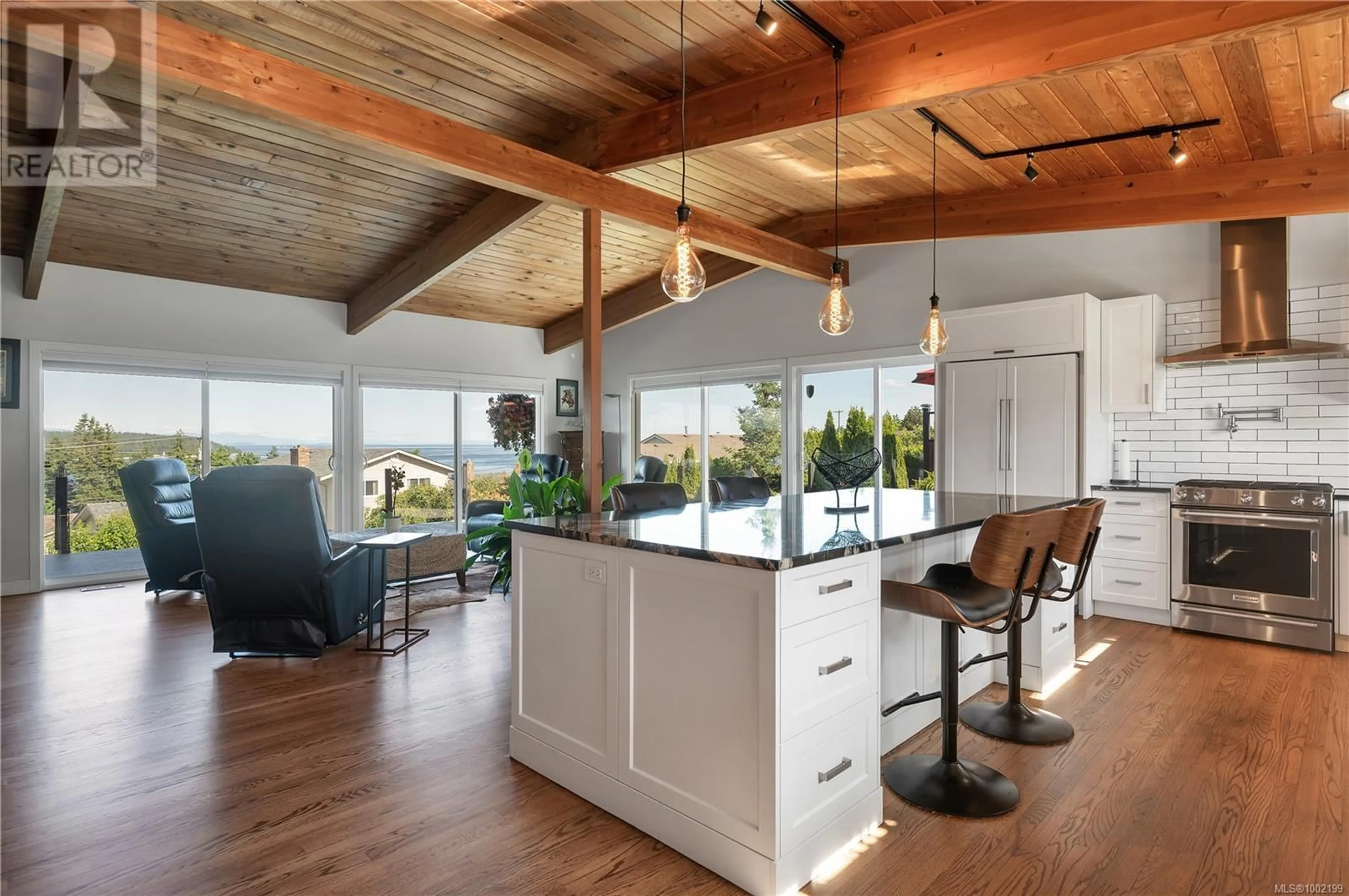 Open concept kitchen, wood/laminate floor for 235 THULIN STREET SOUTH, Campbell River British Columbia V9W2J9