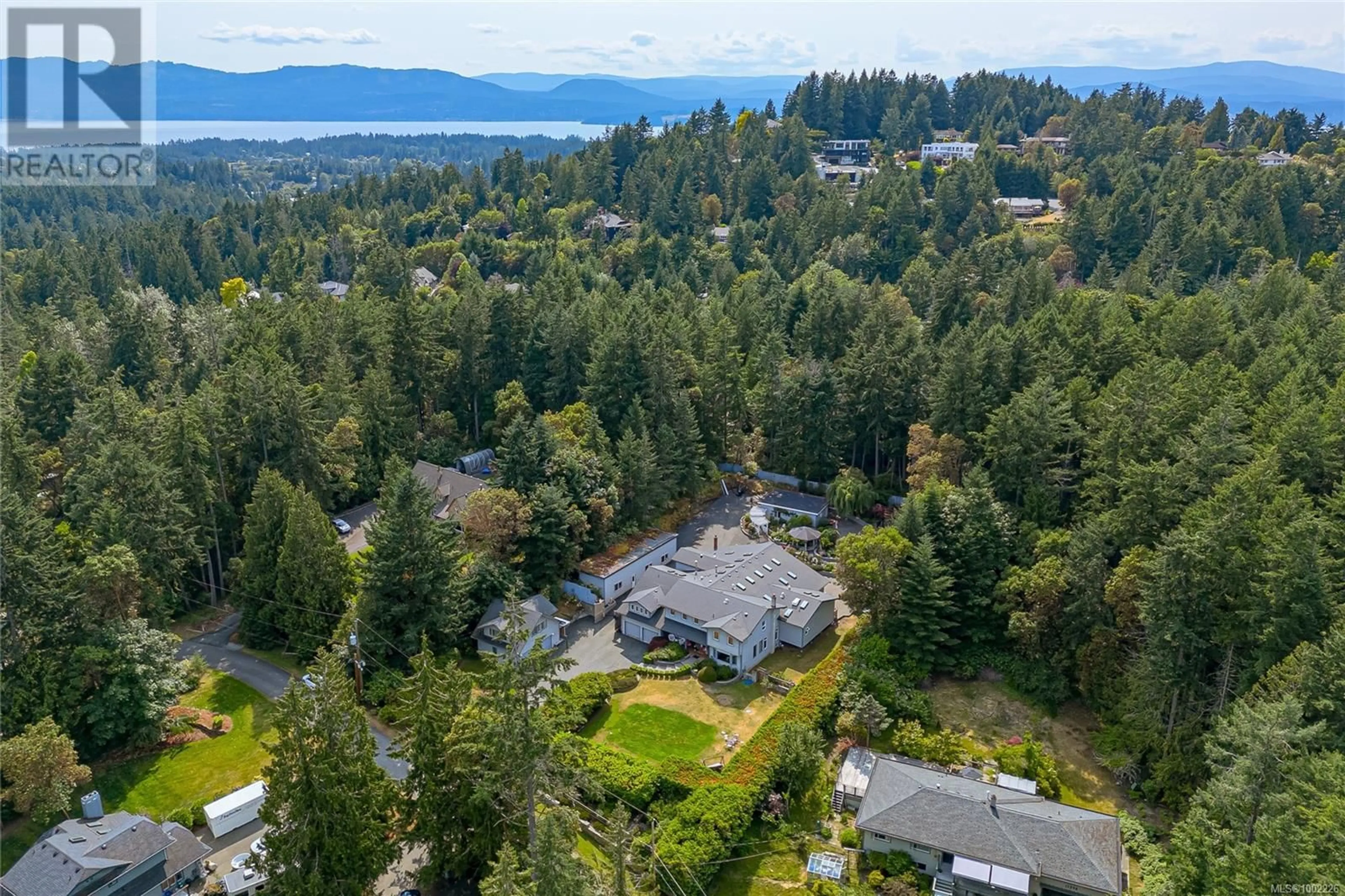 A pic from outside/outdoor area/front of a property/back of a property/a pic from drone, forest/trees view for 11376 OSPREY PLACE, North Saanich British Columbia V8L5K6