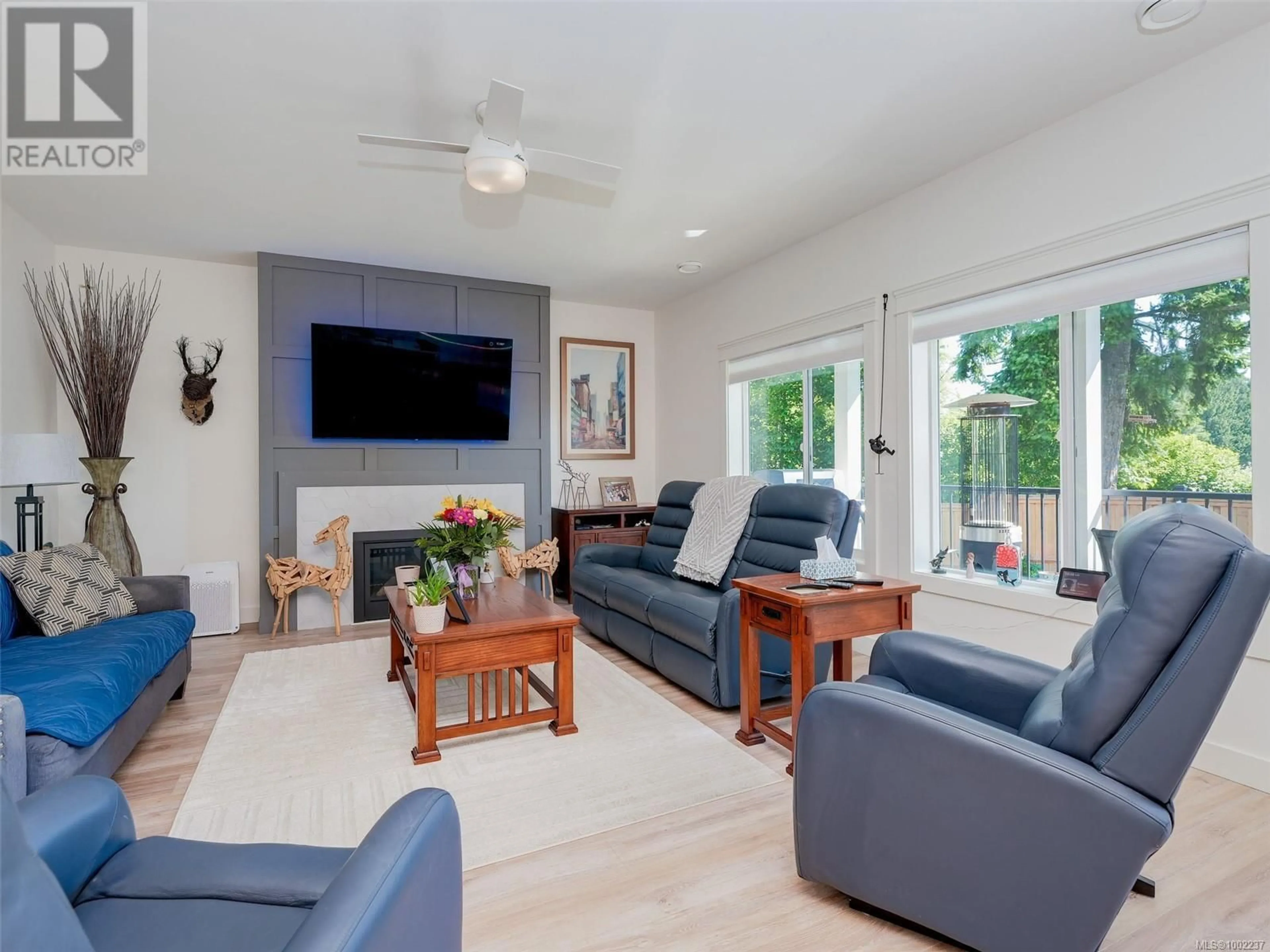 Living room with furniture, wood/laminate floor for 6512 NOBLEWOOD PLACE, Sooke British Columbia V9Z0W3