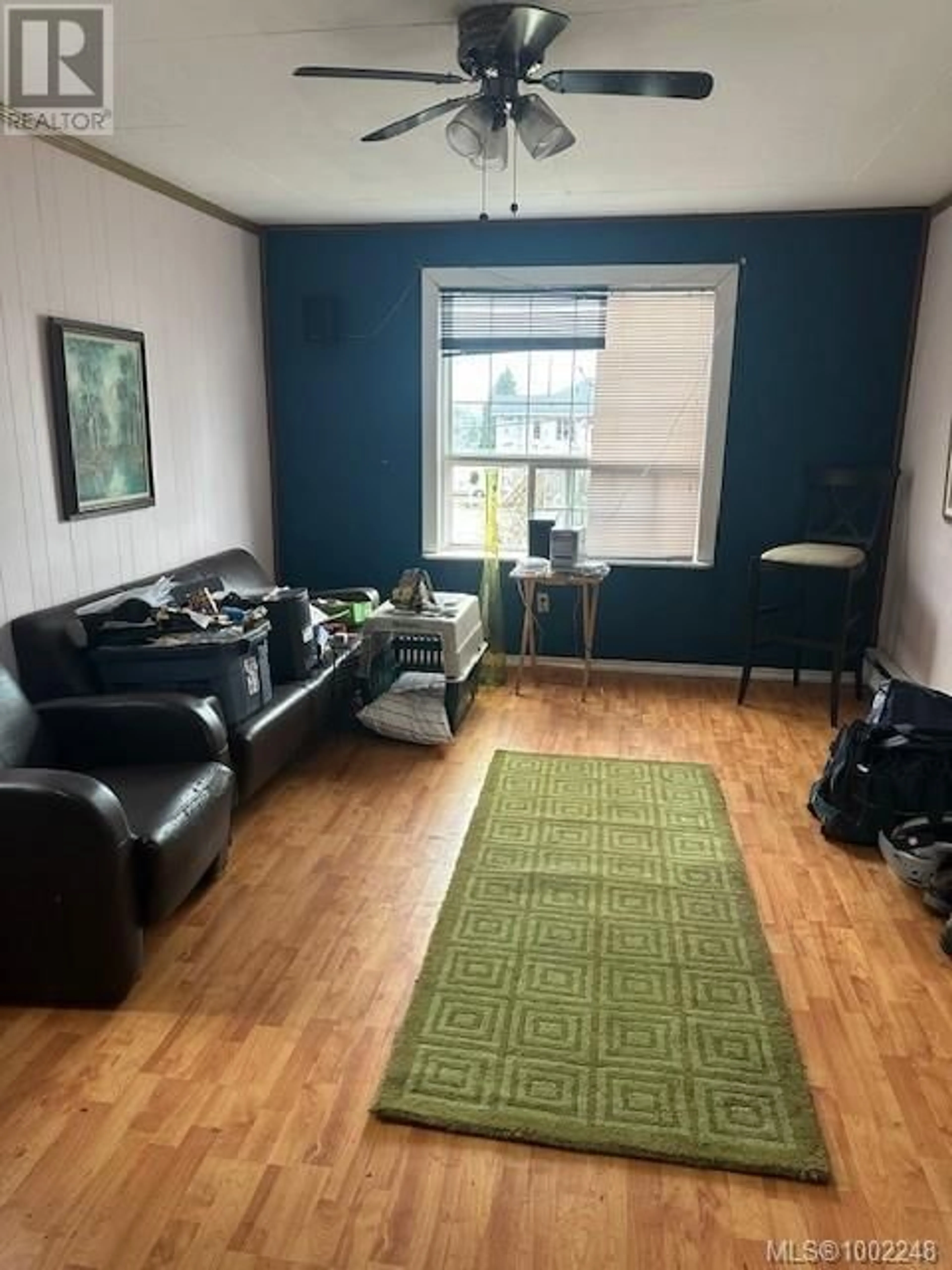 Living room with furniture, wood/laminate floor for 608 HAREWOOD ROAD, Nanaimo British Columbia V9R2Z7