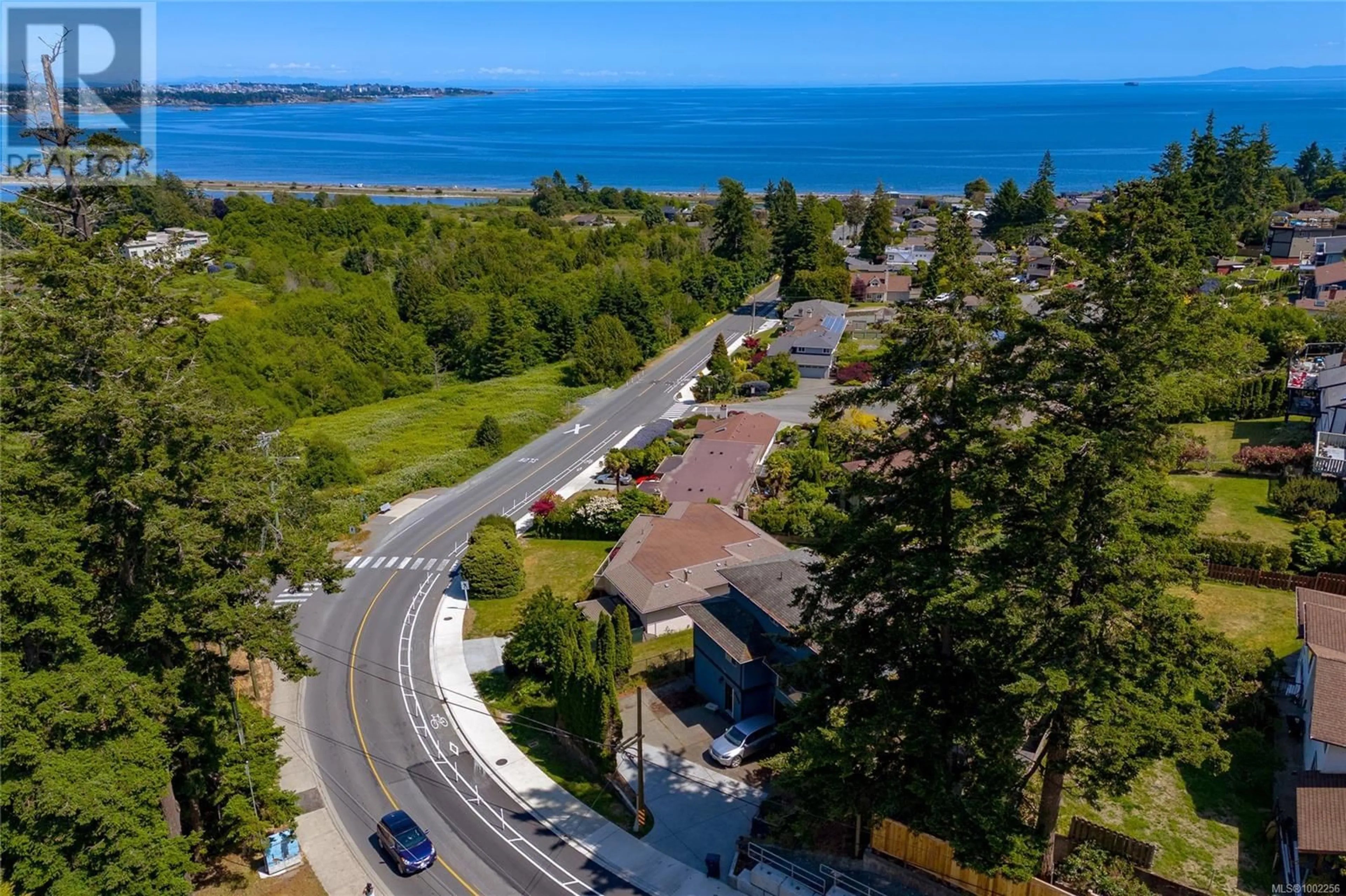 A pic from outside/outdoor area/front of a property/back of a property/a pic from drone, water/lake/river/ocean view for 303 LAGOON ROAD, Colwood British Columbia V9C3T3