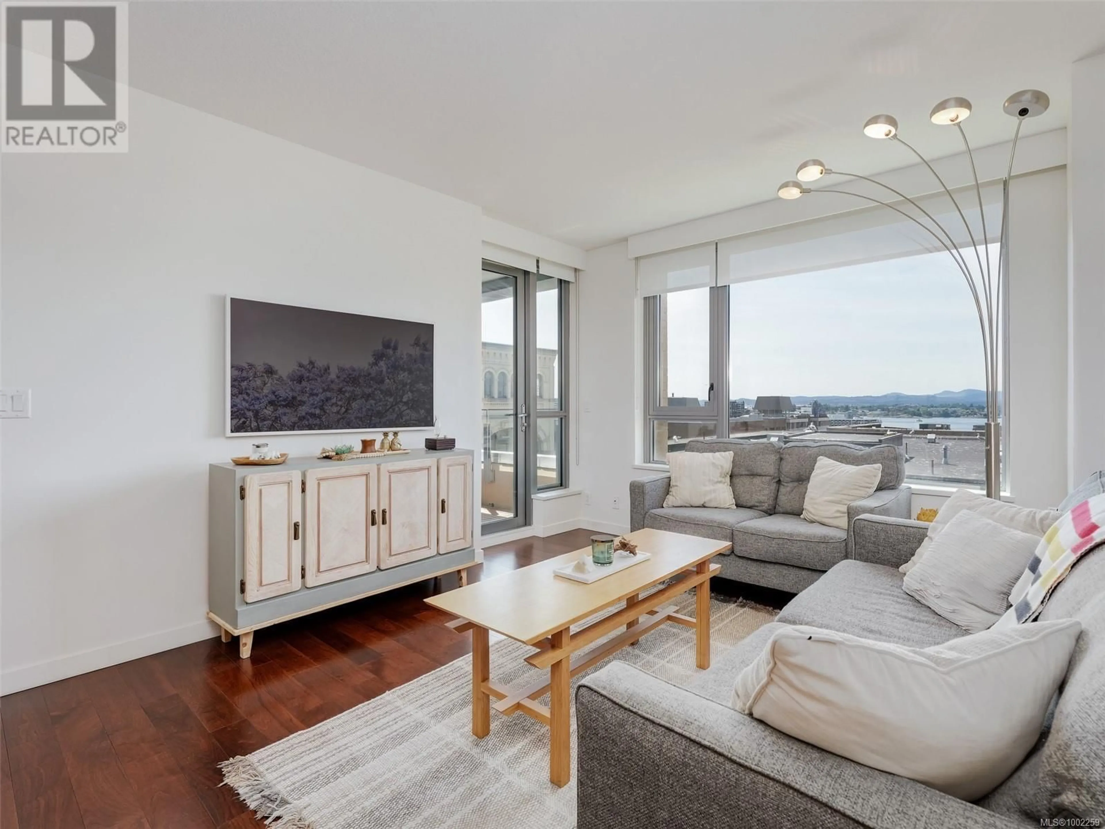 Living room with furniture, wood/laminate floor for 603 - 608 BROUGHTON STREET, Victoria British Columbia V8W1C7