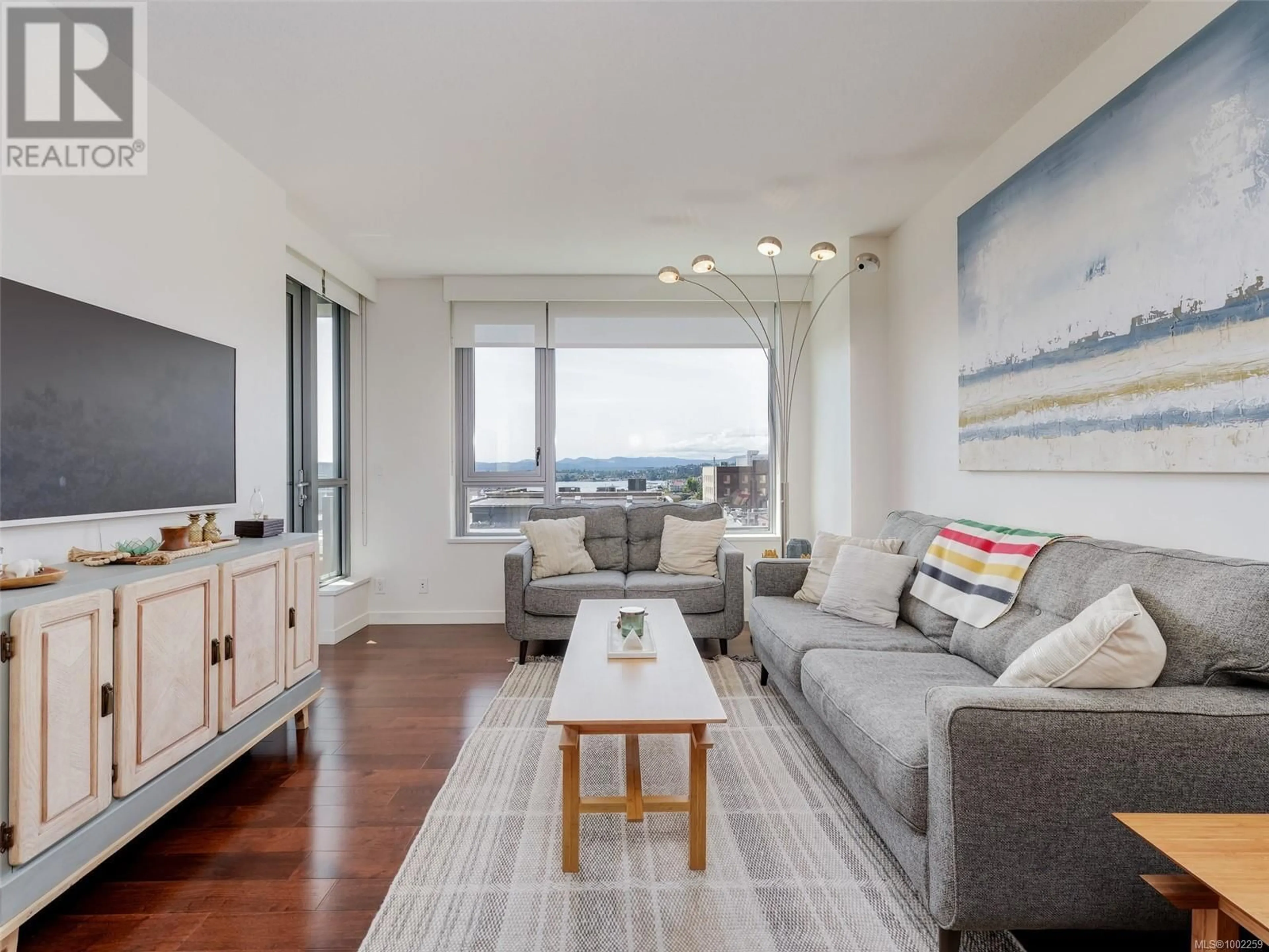Living room with furniture, wood/laminate floor for 603 - 608 BROUGHTON STREET, Victoria British Columbia V8W1C7
