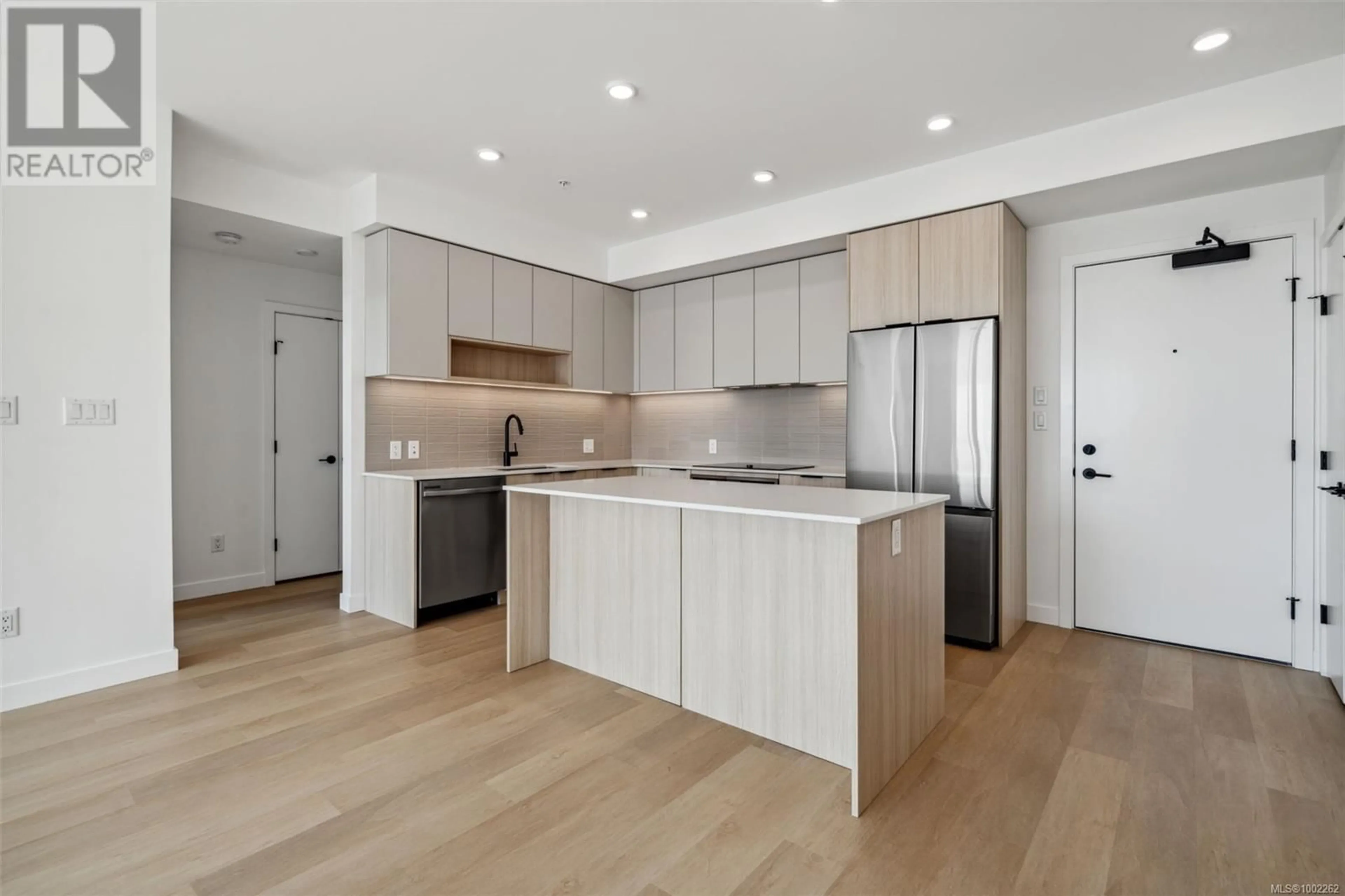 Open concept kitchen, wood/laminate floor for 105 - 3564B RYDER HESJEDAL WAY, Colwood British Columbia V9C0V3