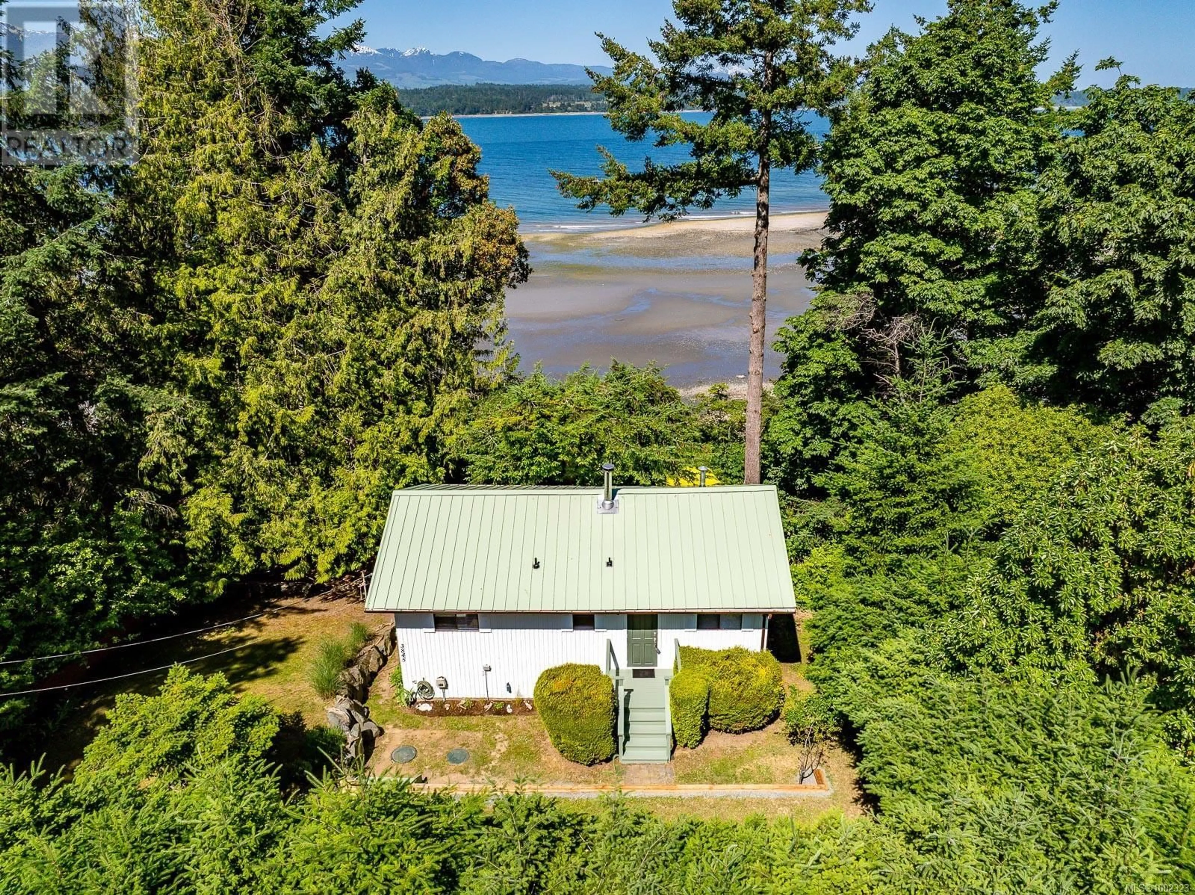 A pic from outside/outdoor area/front of a property/back of a property/a pic from drone, water/lake/river/ocean view for 3845 SHINGLE SPIT ROAD, Hornby Island British Columbia V0R1Z0