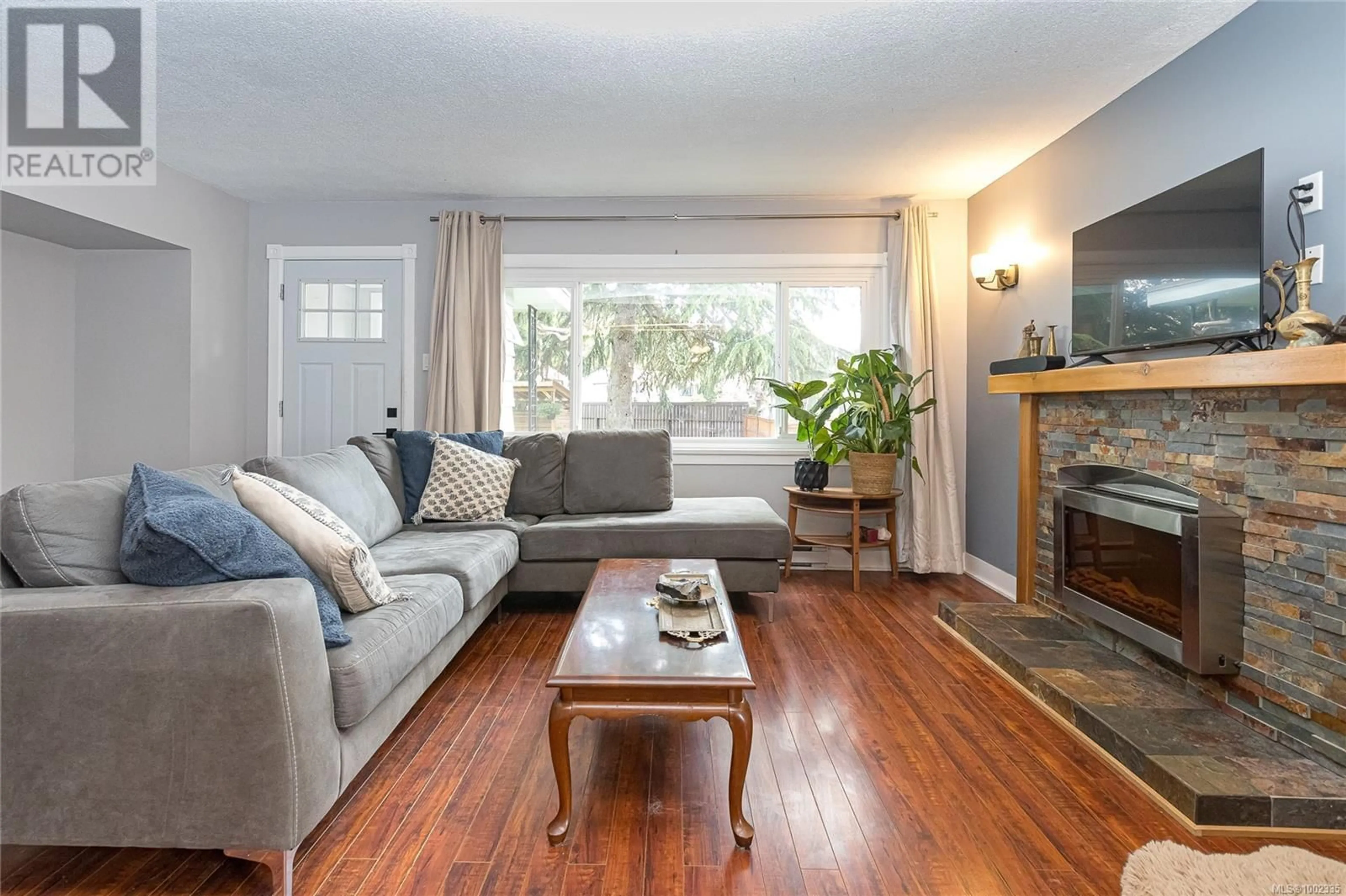 Living room with furniture, wood/laminate floor for 2308 SOOKE ROAD, Colwood British Columbia V9B1X5