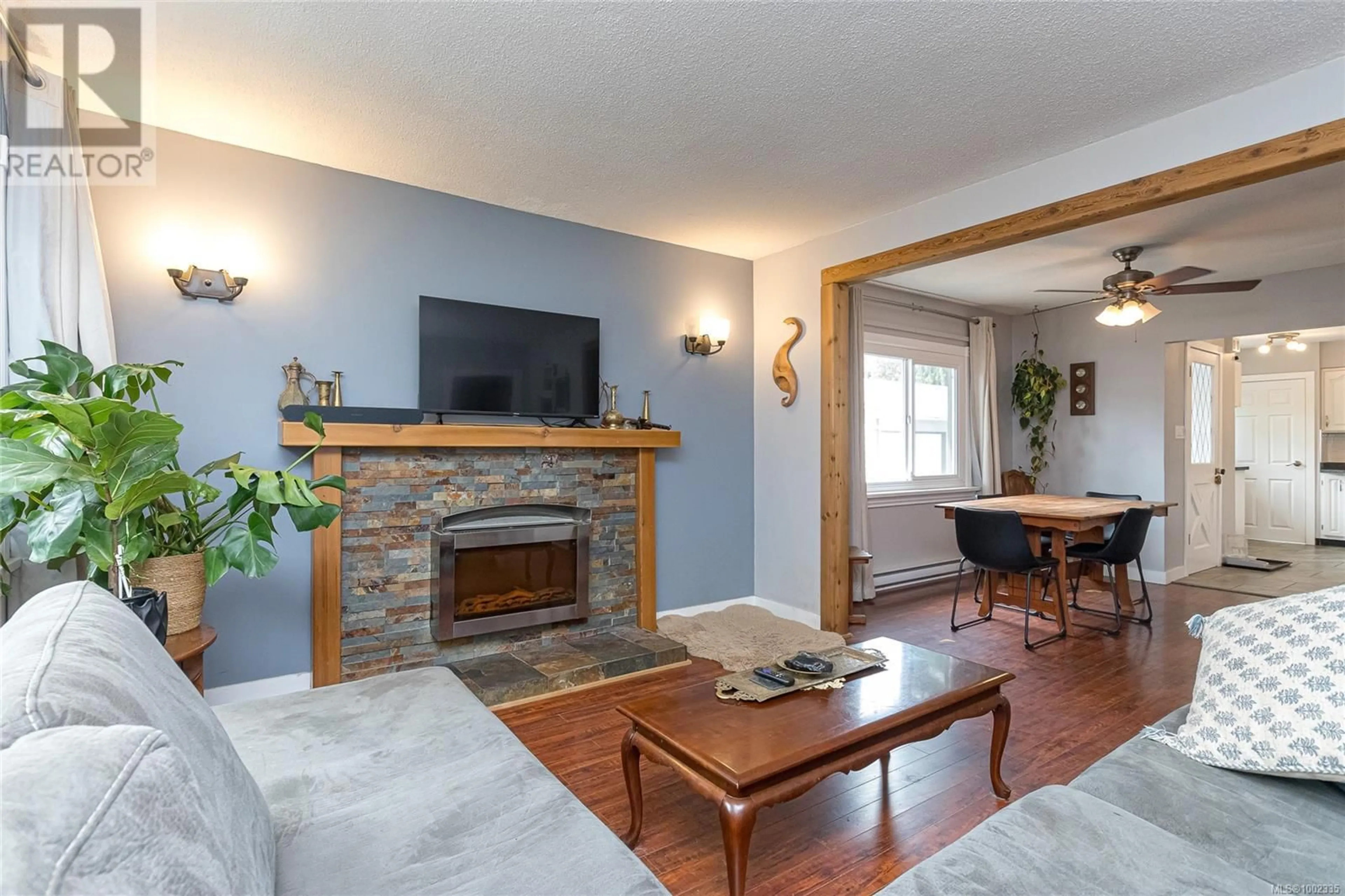 Living room with furniture, wood/laminate floor for 2308 SOOKE ROAD, Colwood British Columbia V9B1X5
