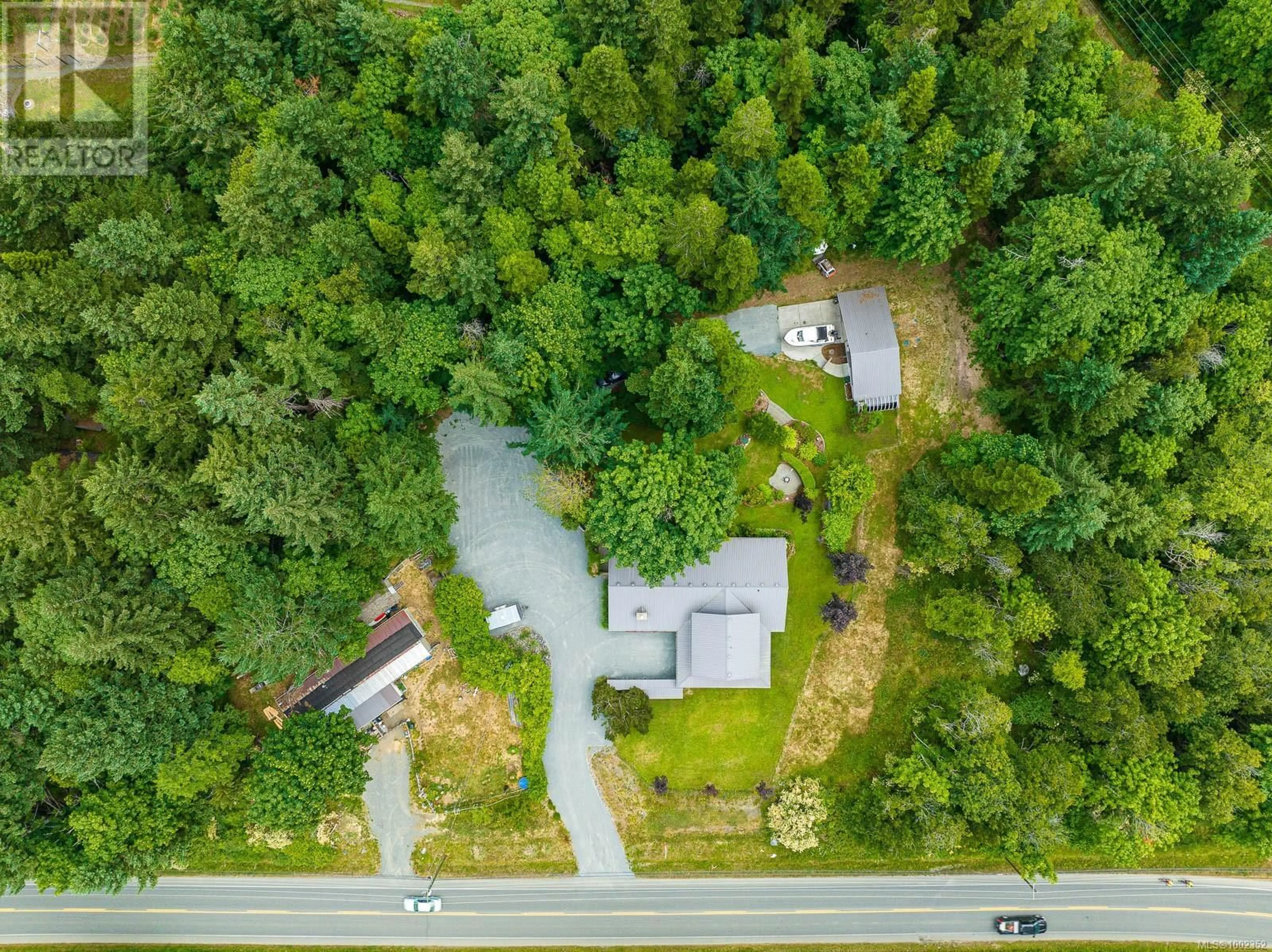 A pic from outside/outdoor area/front of a property/back of a property/a pic from drone, forest/trees view for 1872 WAVELAND ROAD, Courtenay British Columbia V9N8H8