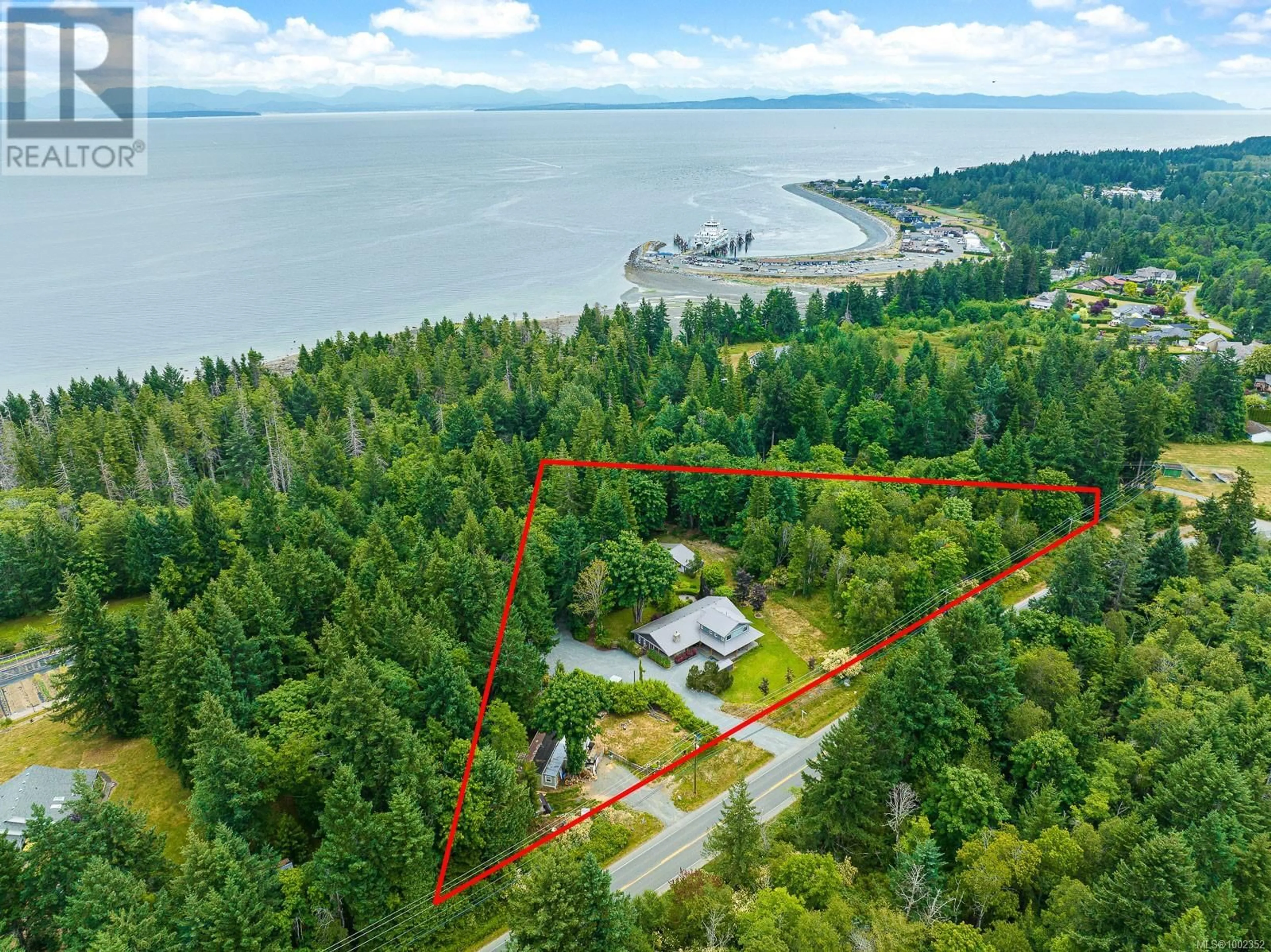 A pic from outside/outdoor area/front of a property/back of a property/a pic from drone, water/lake/river/ocean view for 1872 WAVELAND ROAD, Courtenay British Columbia V9N8H8