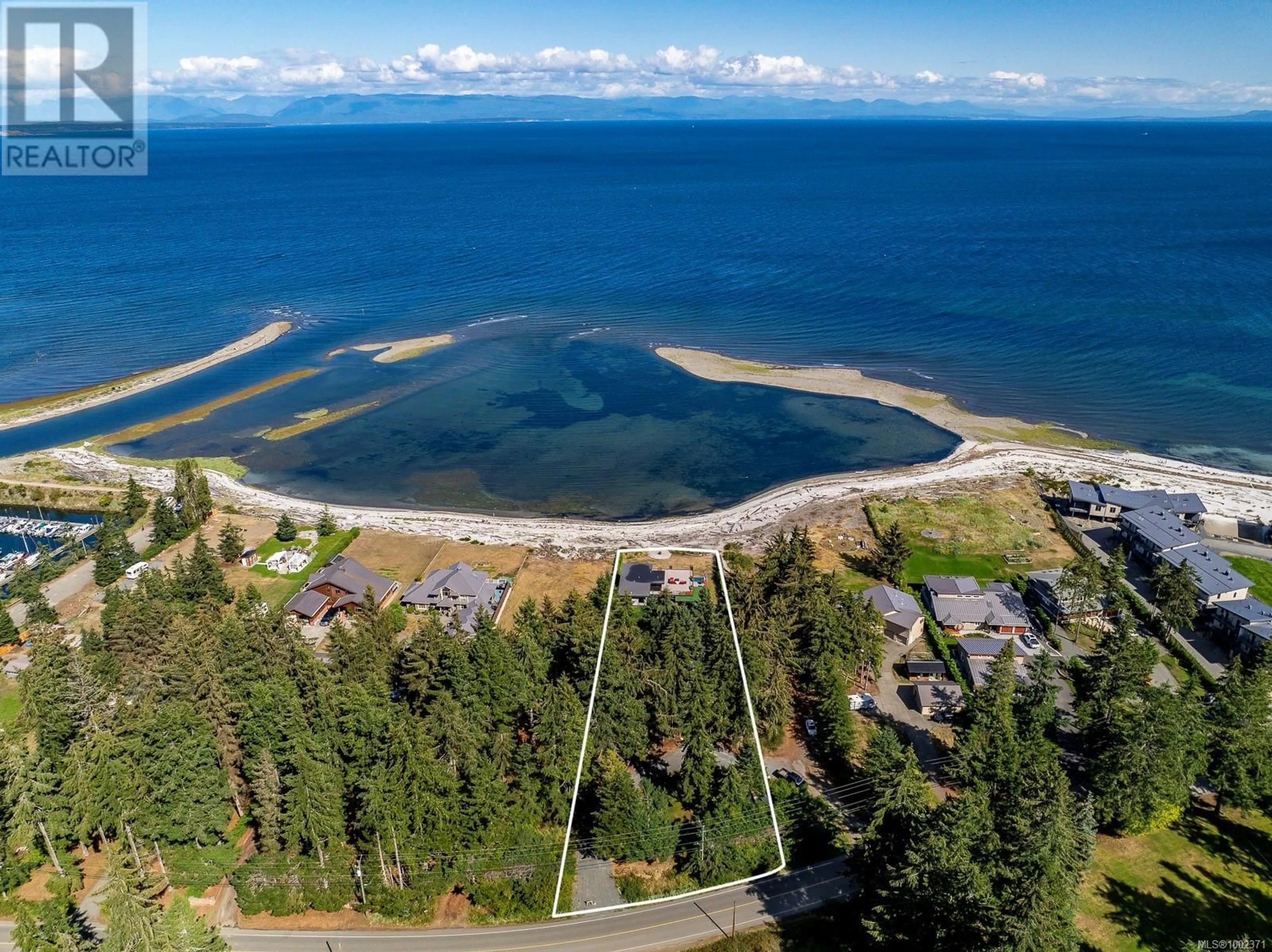 A pic from outside/outdoor area/front of a property/back of a property/a pic from drone, water/lake/river/ocean view for 9046 CLARKSON AVENUE, Black Creek British Columbia V9J1B3