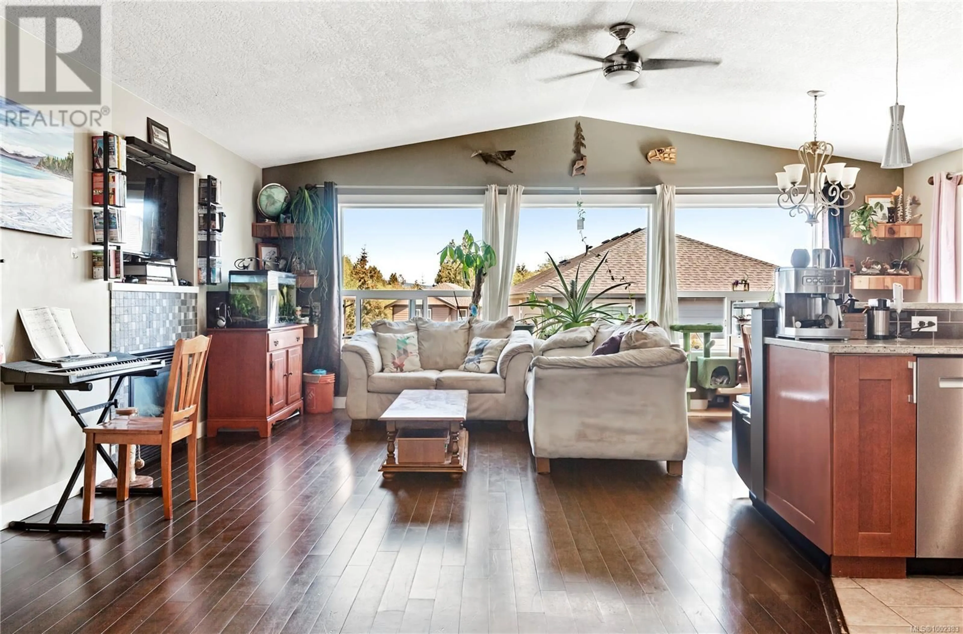 Living room with furniture, wood/laminate floor for 6561 ARRANWOOD DRIVE, Sooke British Columbia V9Z0W4