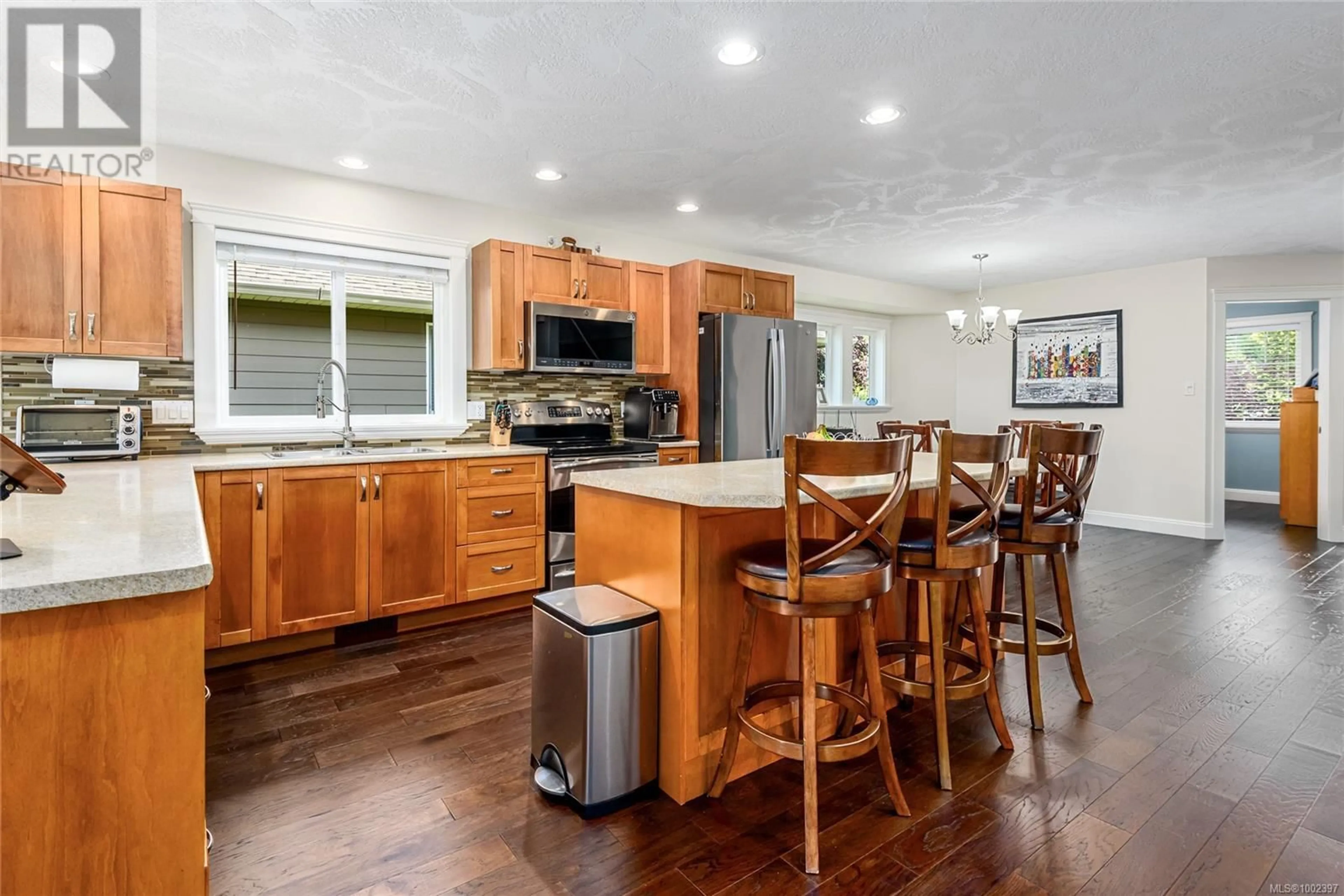 Open concept kitchen, wood/laminate floor for 2457 CANUCK PLACE, Comox British Columbia V9M0A2