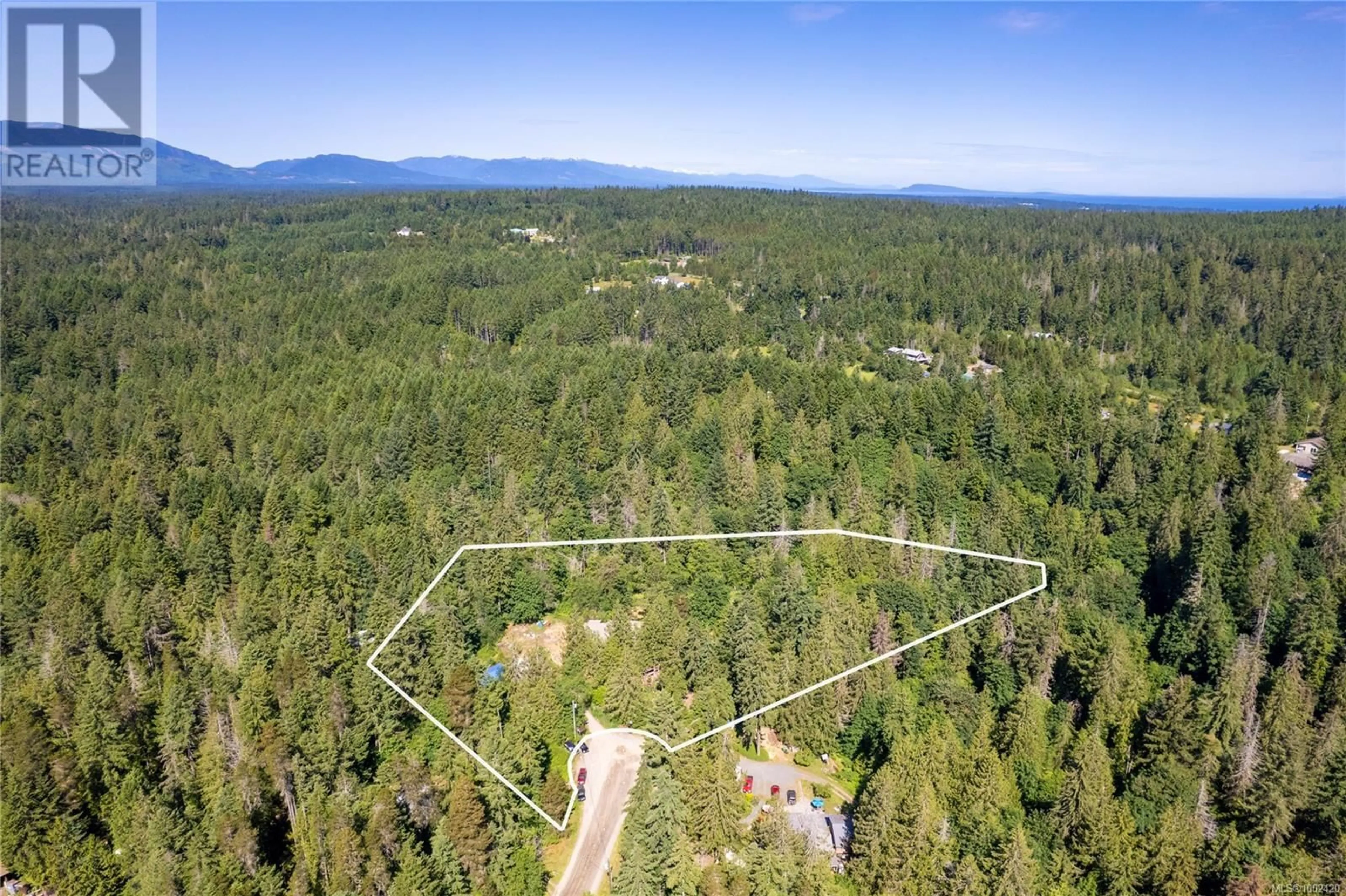A pic from outside/outdoor area/front of a property/back of a property/a pic from drone, forest/trees view for 1550 WELLS PLACE, Errington British Columbia V0R1V0