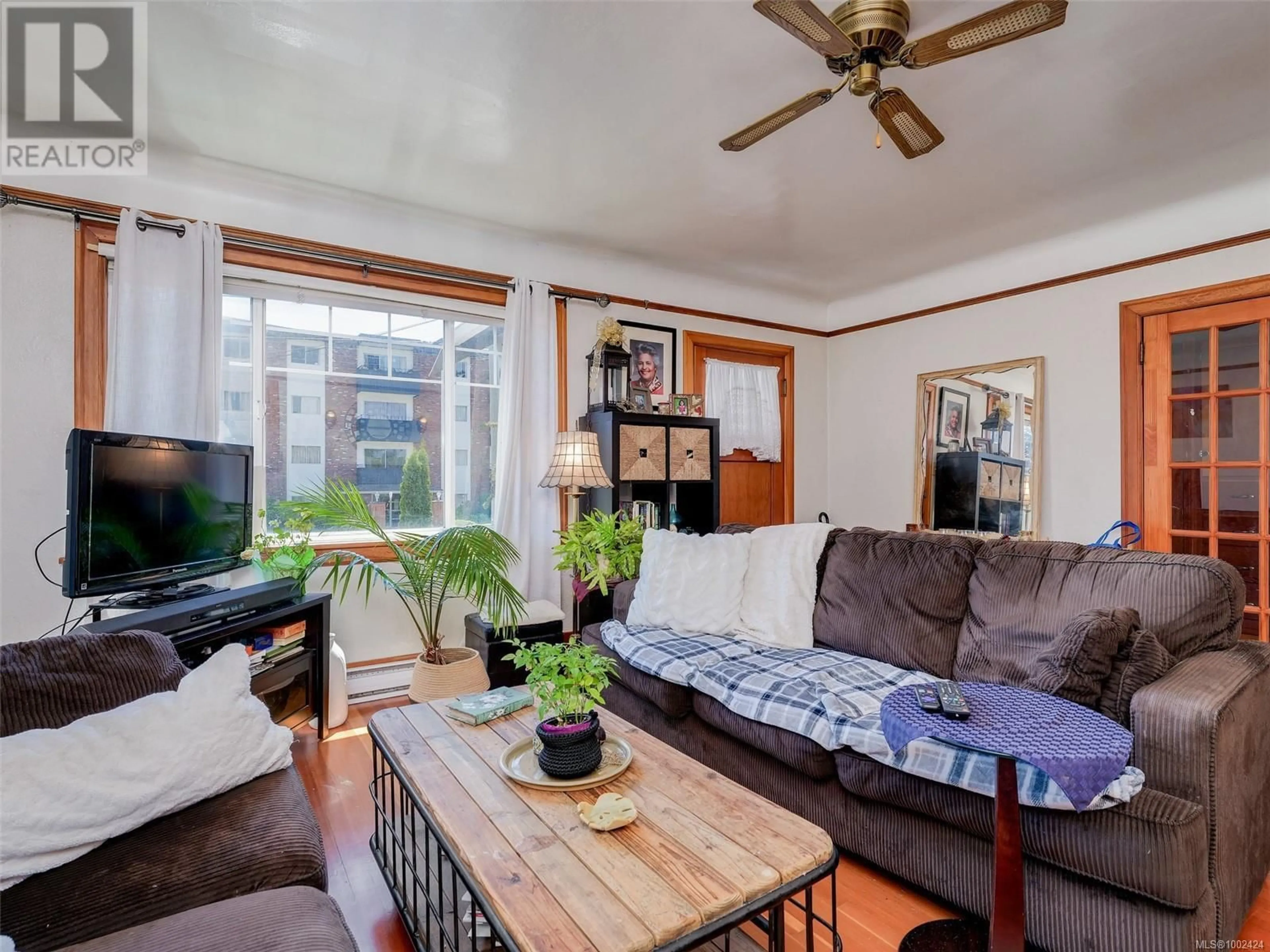 Living room with furniture, wood/laminate floor for 866A OLD ESQUIMALT ROAD, Esquimalt British Columbia V9A4X2