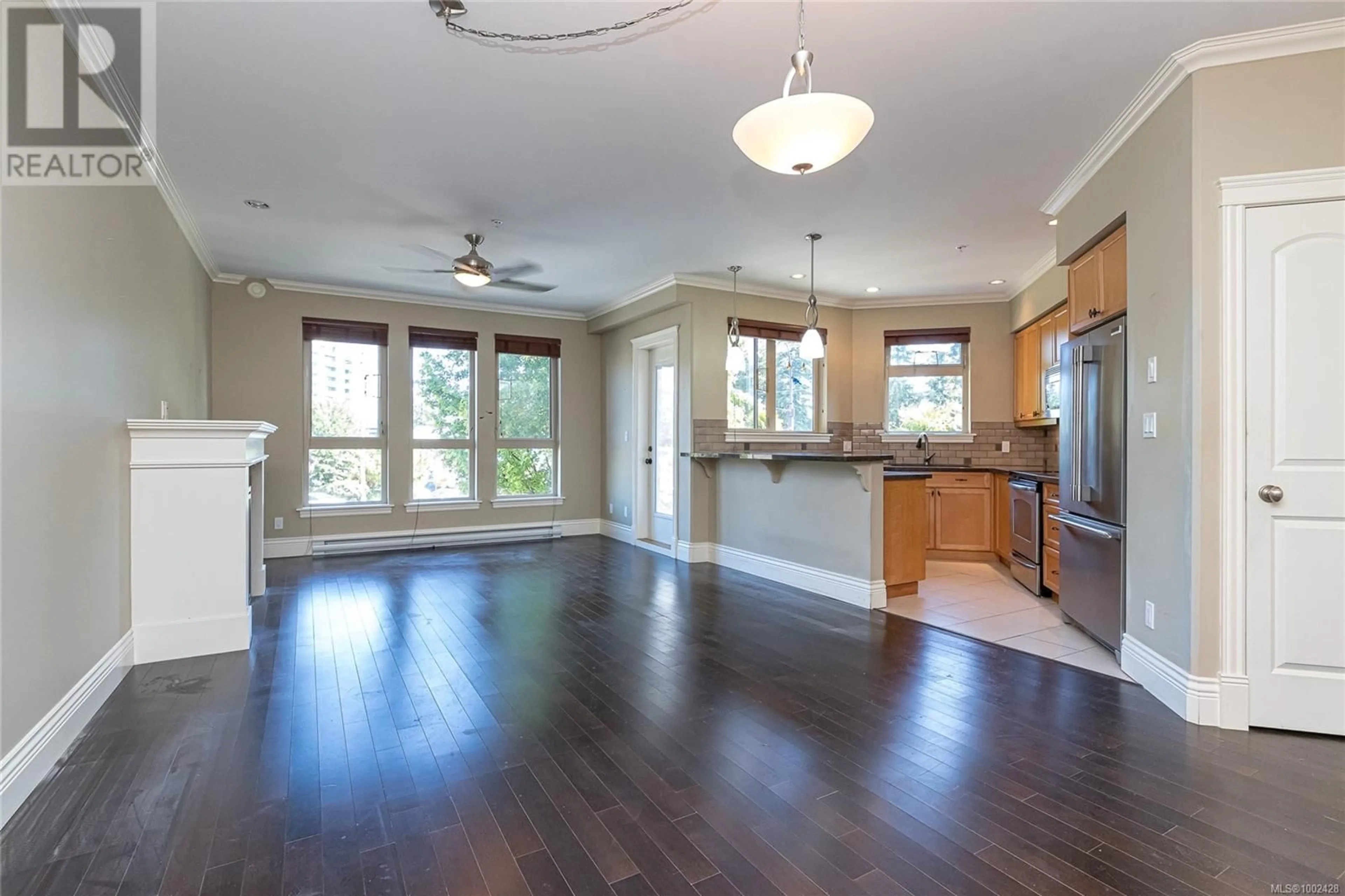 Open concept kitchen, wood/laminate floor for 206 - 755 GOLDSTREAM AVENUE, Langford British Columbia V9B2X4