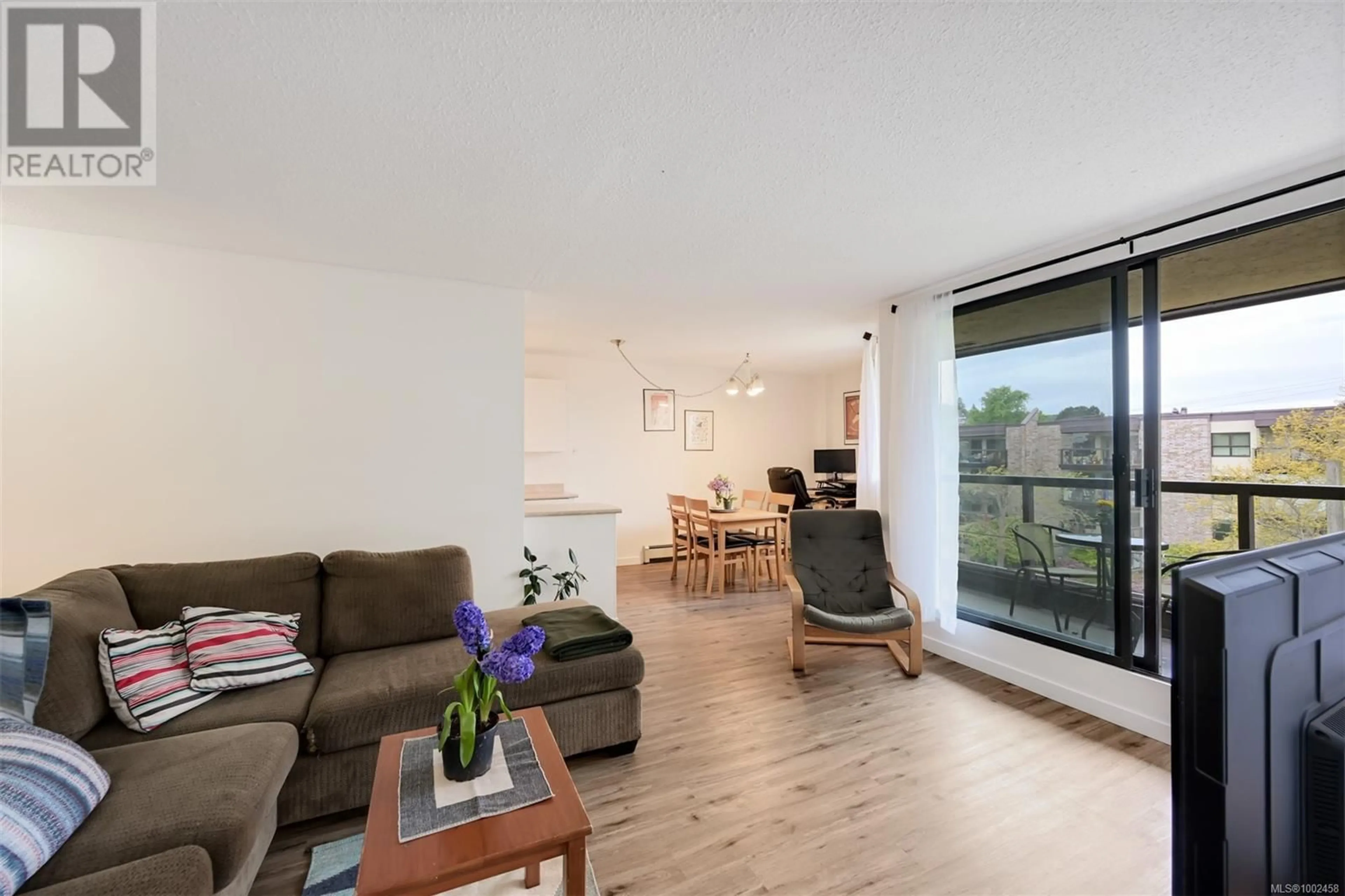 Living room with furniture, wood/laminate floor for 410 - 1745 LEIGHTON ROAD, Victoria British Columbia V8R6R6