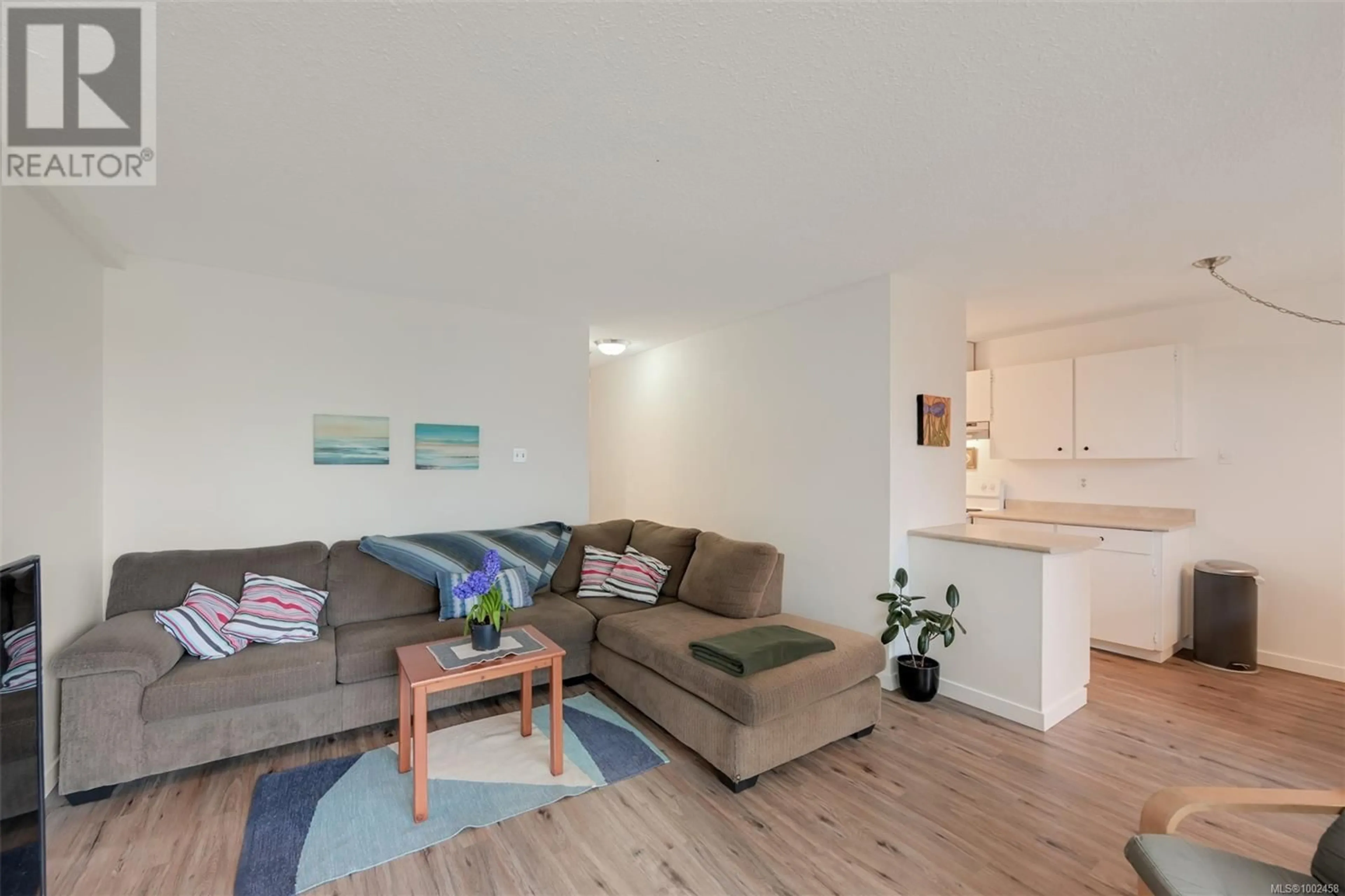 Living room with furniture, wood/laminate floor for 410 - 1745 LEIGHTON ROAD, Victoria British Columbia V8R6R6