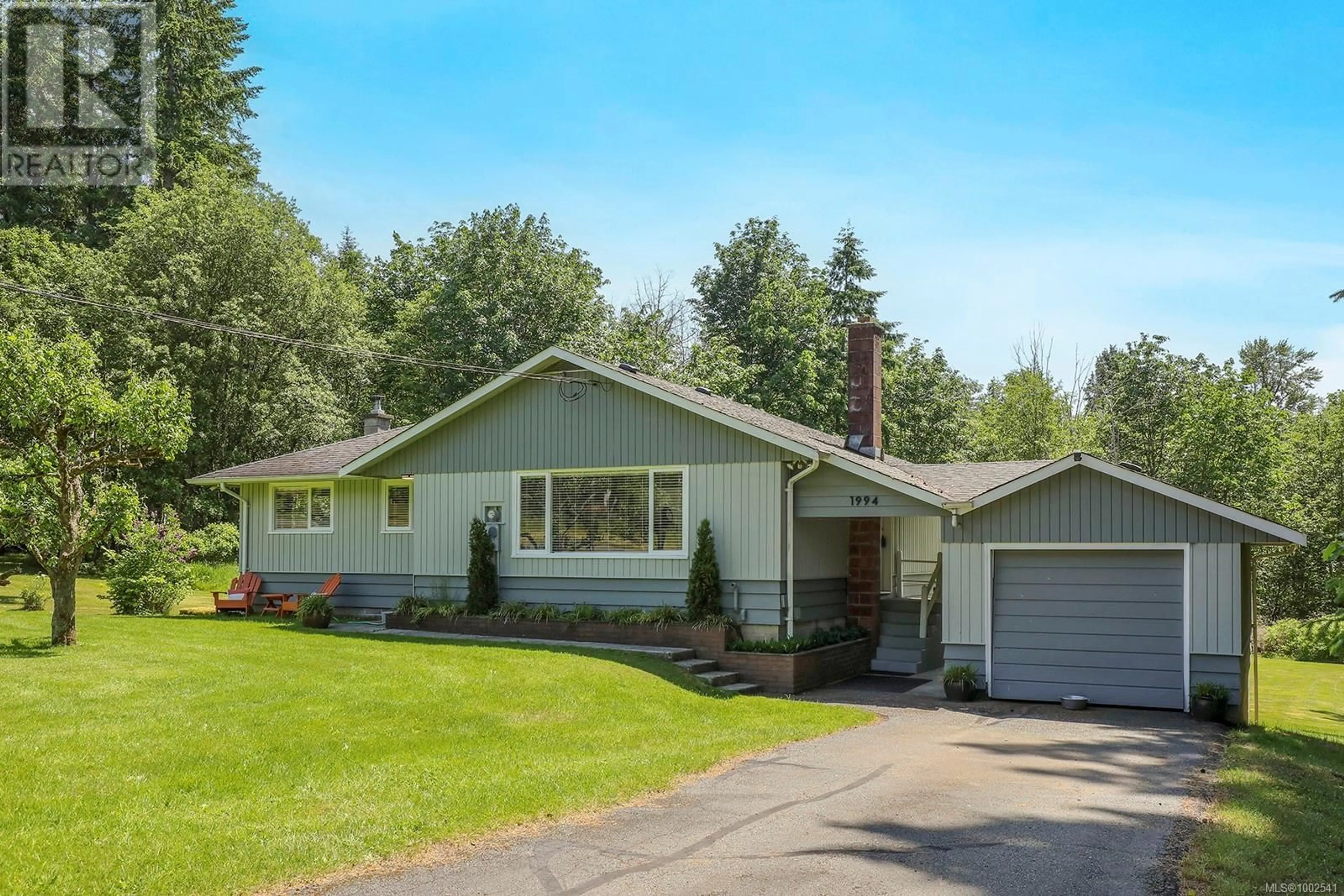 Home with vinyl exterior material, street for 1994 KELLAND ROAD, Black Creek British Columbia V9J1G4