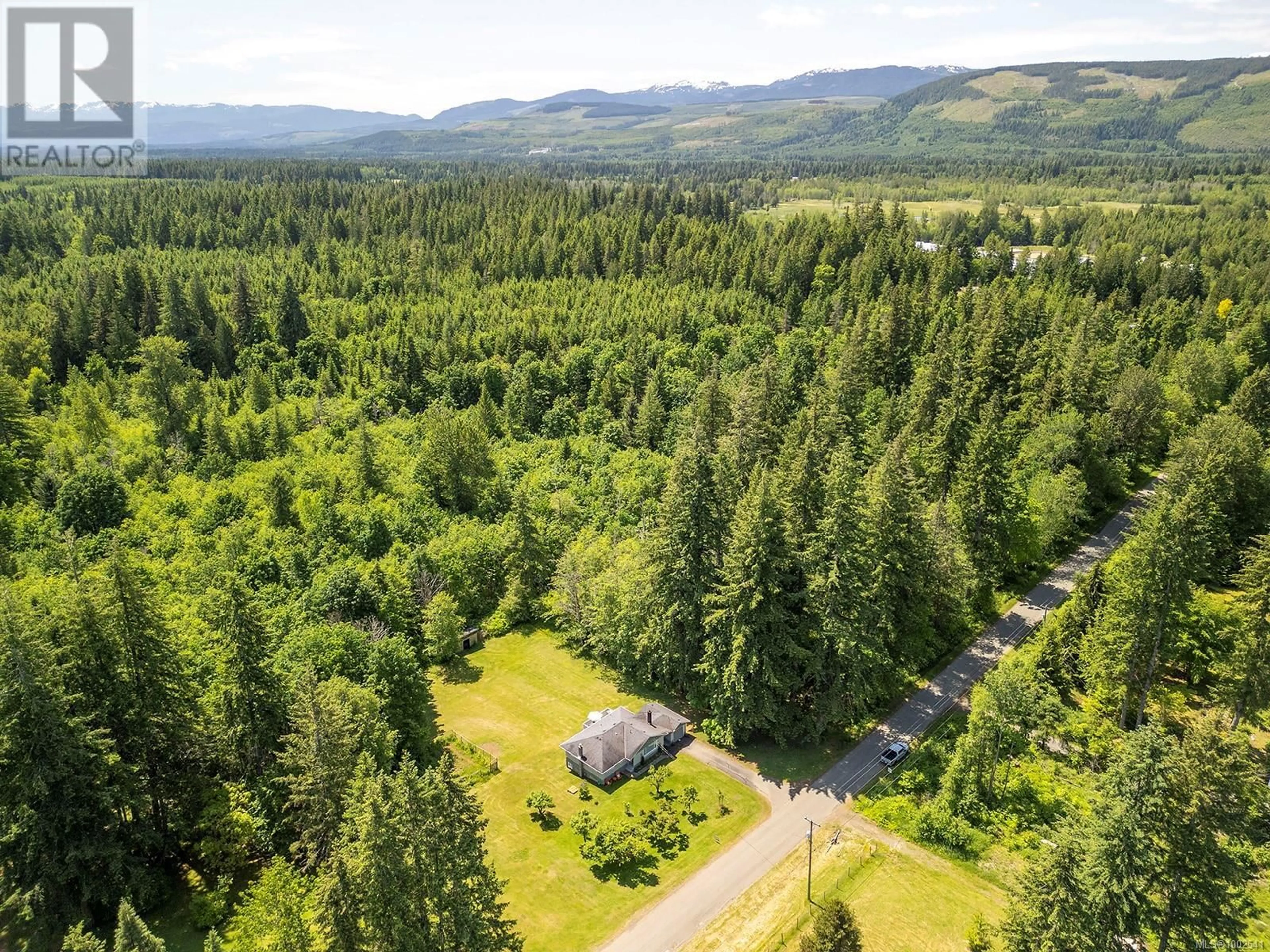 A pic from outside/outdoor area/front of a property/back of a property/a pic from drone, forest/trees view for 1994 KELLAND ROAD, Black Creek British Columbia V9J1G4