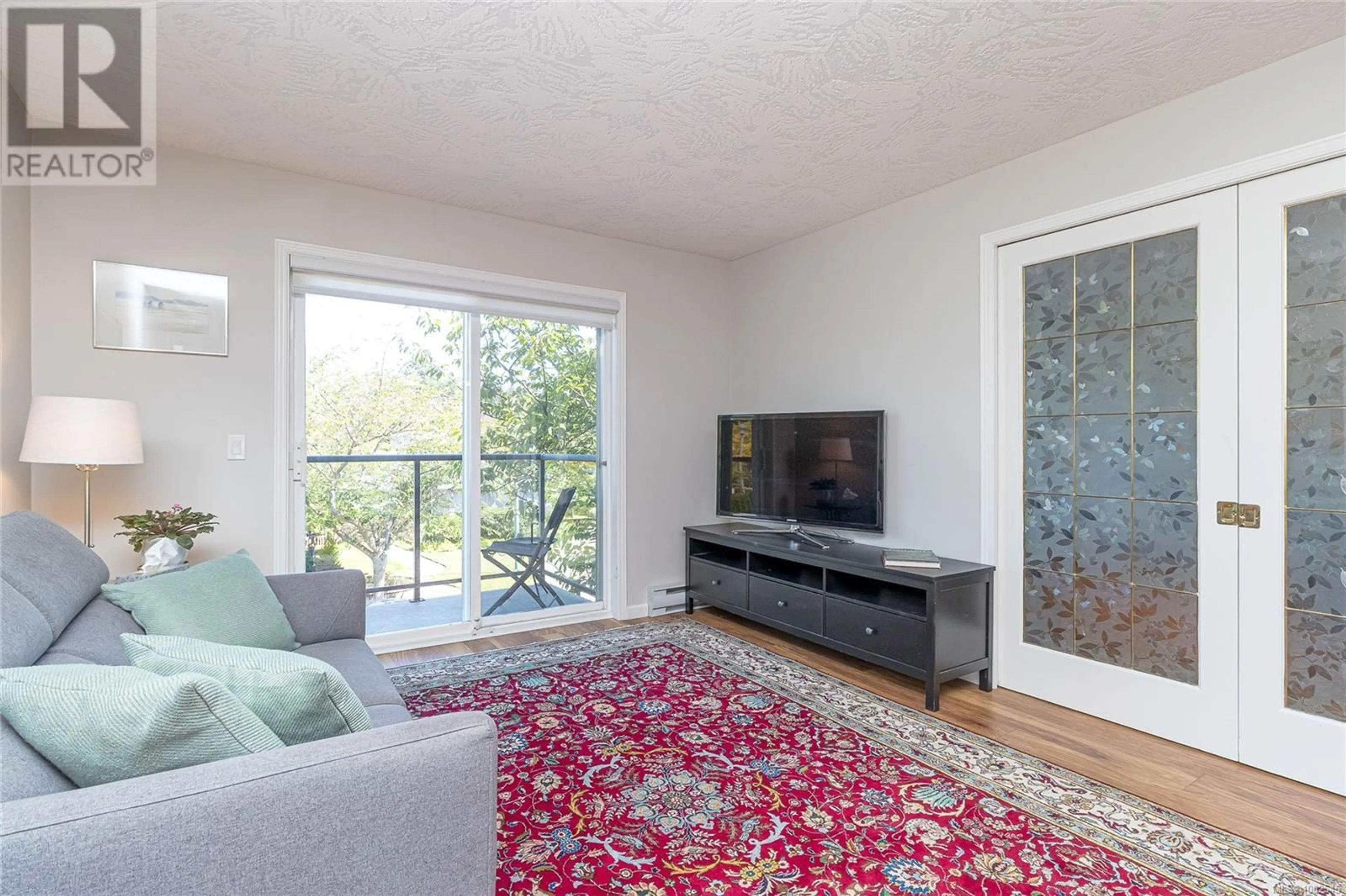Living room with furniture, unknown for 215 - 1485 GARNET ROAD, Saanich British Columbia V8P5T5