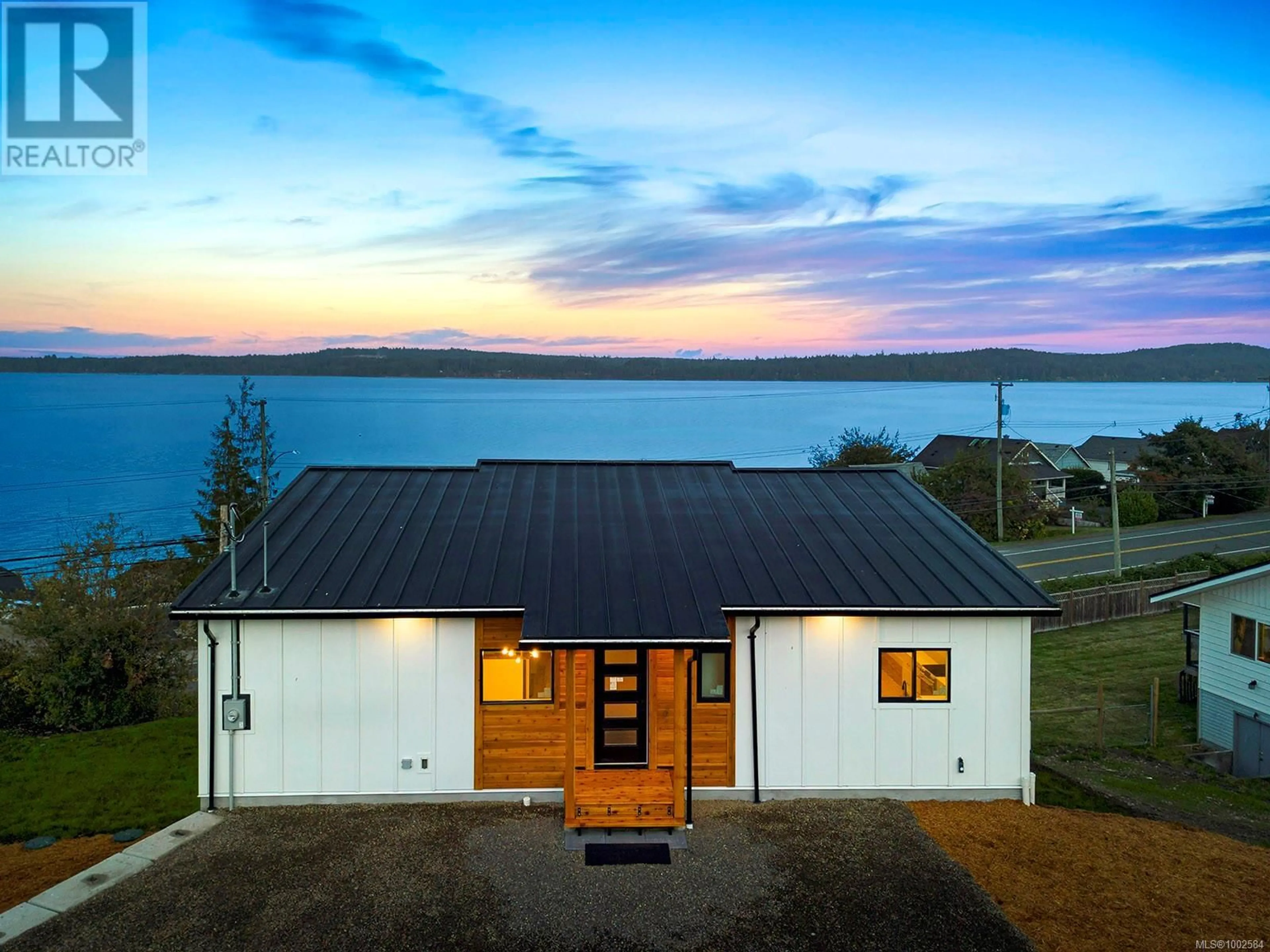 A pic from outside/outdoor area/front of a property/back of a property/a pic from drone, water/lake/river/ocean view for 5622 1ST STREET, Union Bay British Columbia V0R3B0