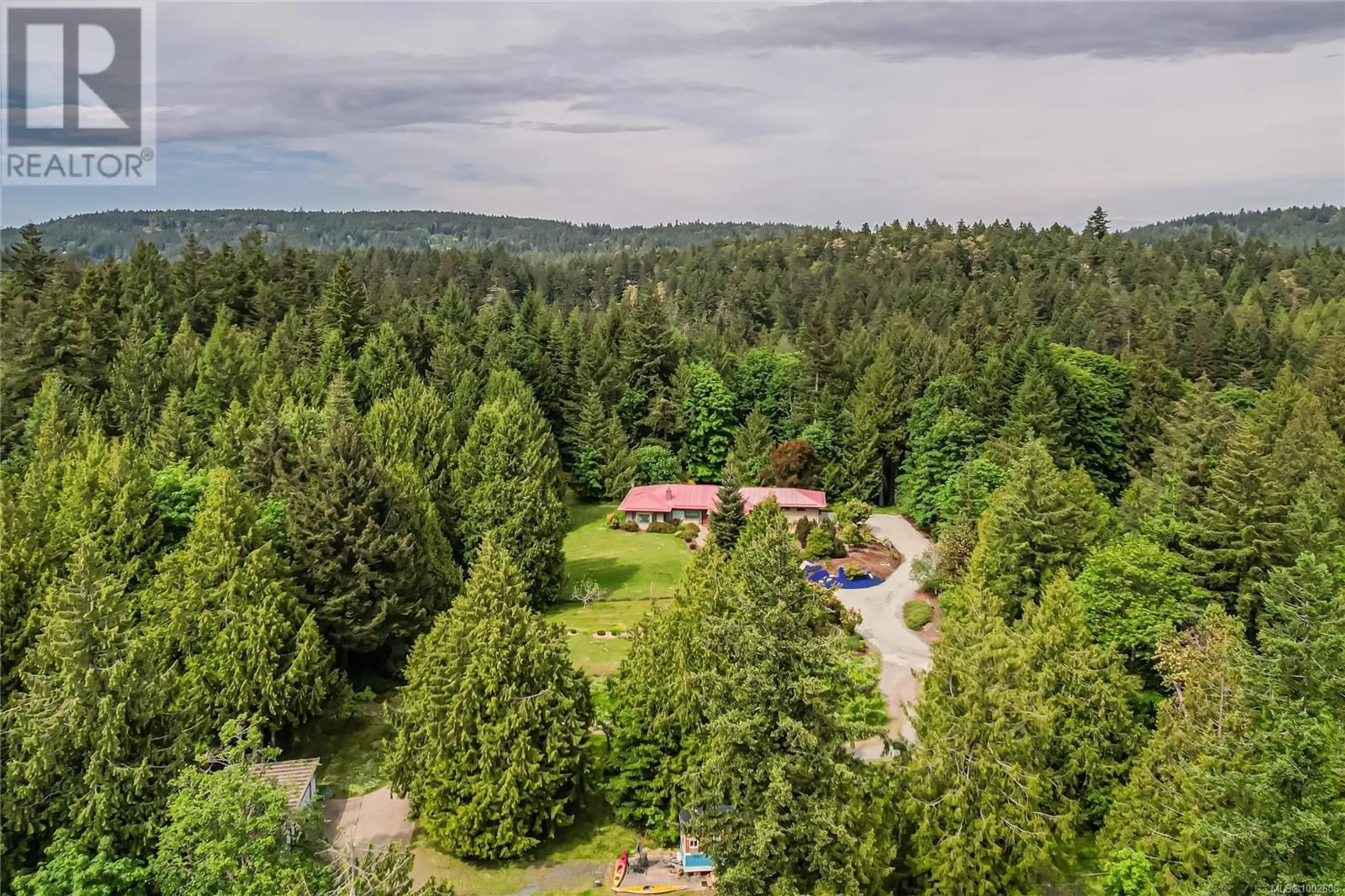 A pic from outside/outdoor area/front of a property/back of a property/a pic from drone, forest/trees view for 210 NORTON ROAD, Salt Spring British Columbia V8K1C7