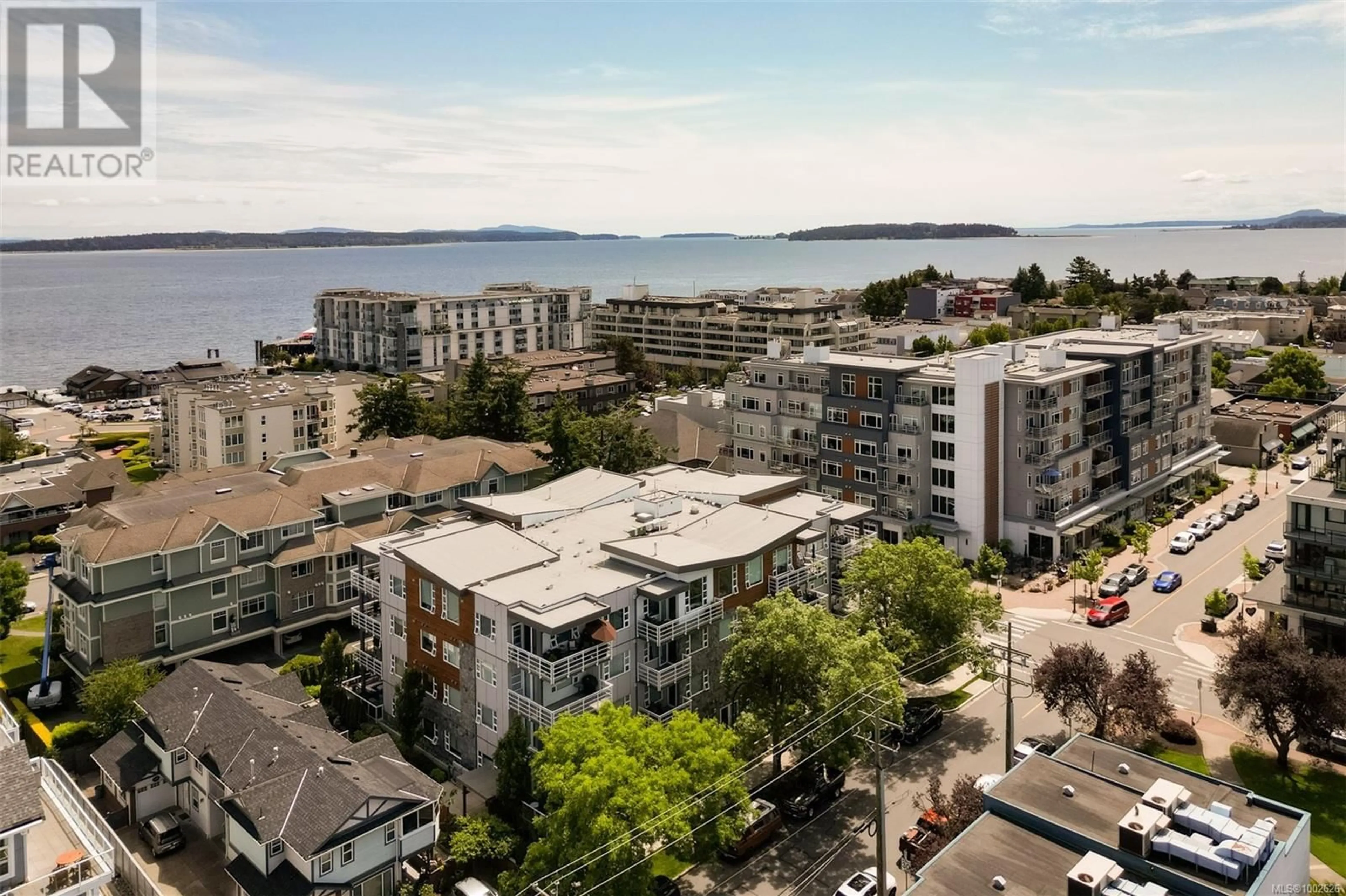 A pic from outside/outdoor area/front of a property/back of a property/a pic from drone, water/lake/river/ocean view for 204 - 9861 THIRD STREET, Sidney British Columbia V8L3A8