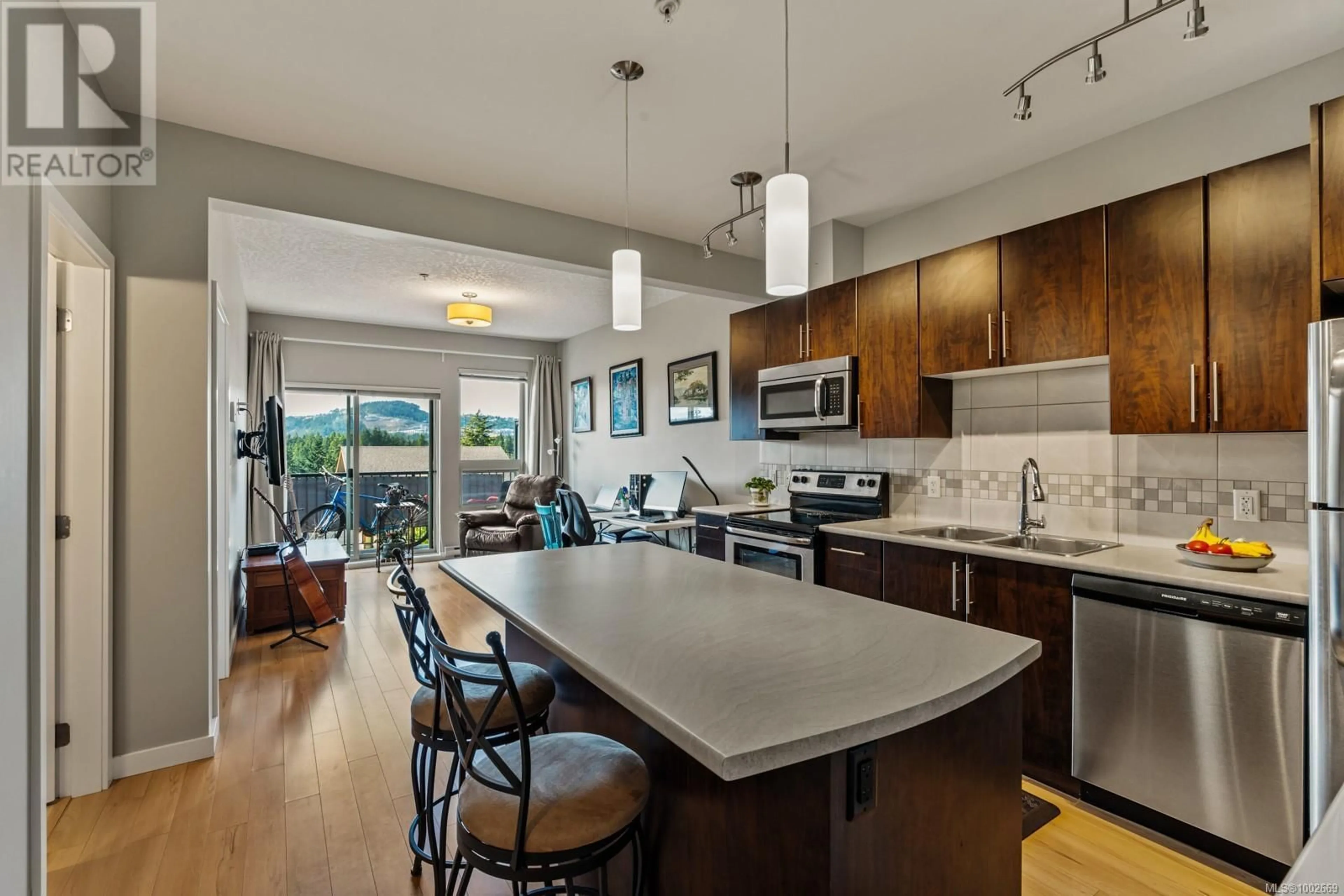 Open concept kitchen, ceramic/tile floor for 411 - 3240 JACKLIN ROAD, Langford British Columbia V9C3T6