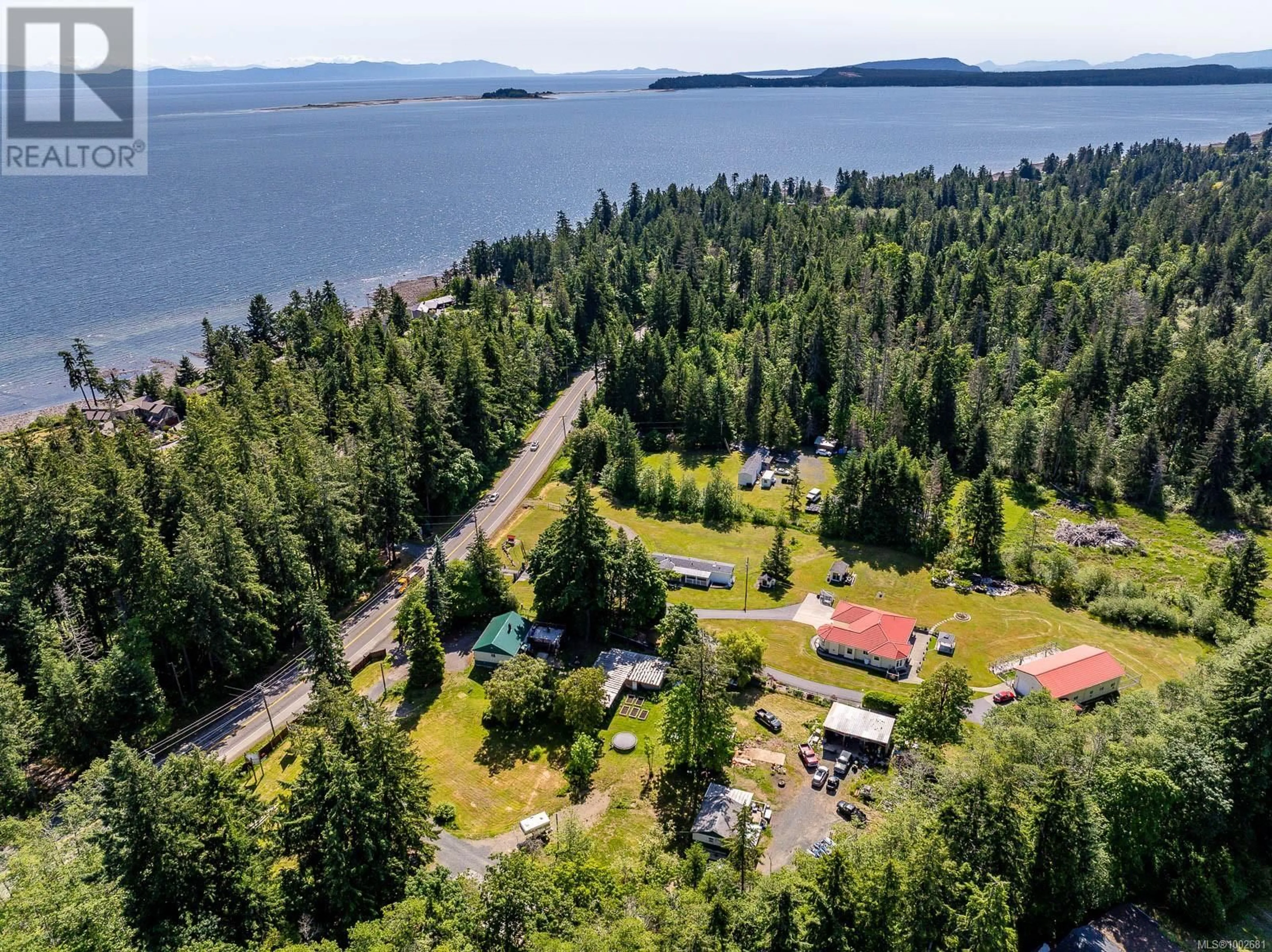 A pic from outside/outdoor area/front of a property/back of a property/a pic from drone, water/lake/river/ocean view for 4399 ISLAND HIGHWAY SOUTH, Courtenay British Columbia V9N9T1