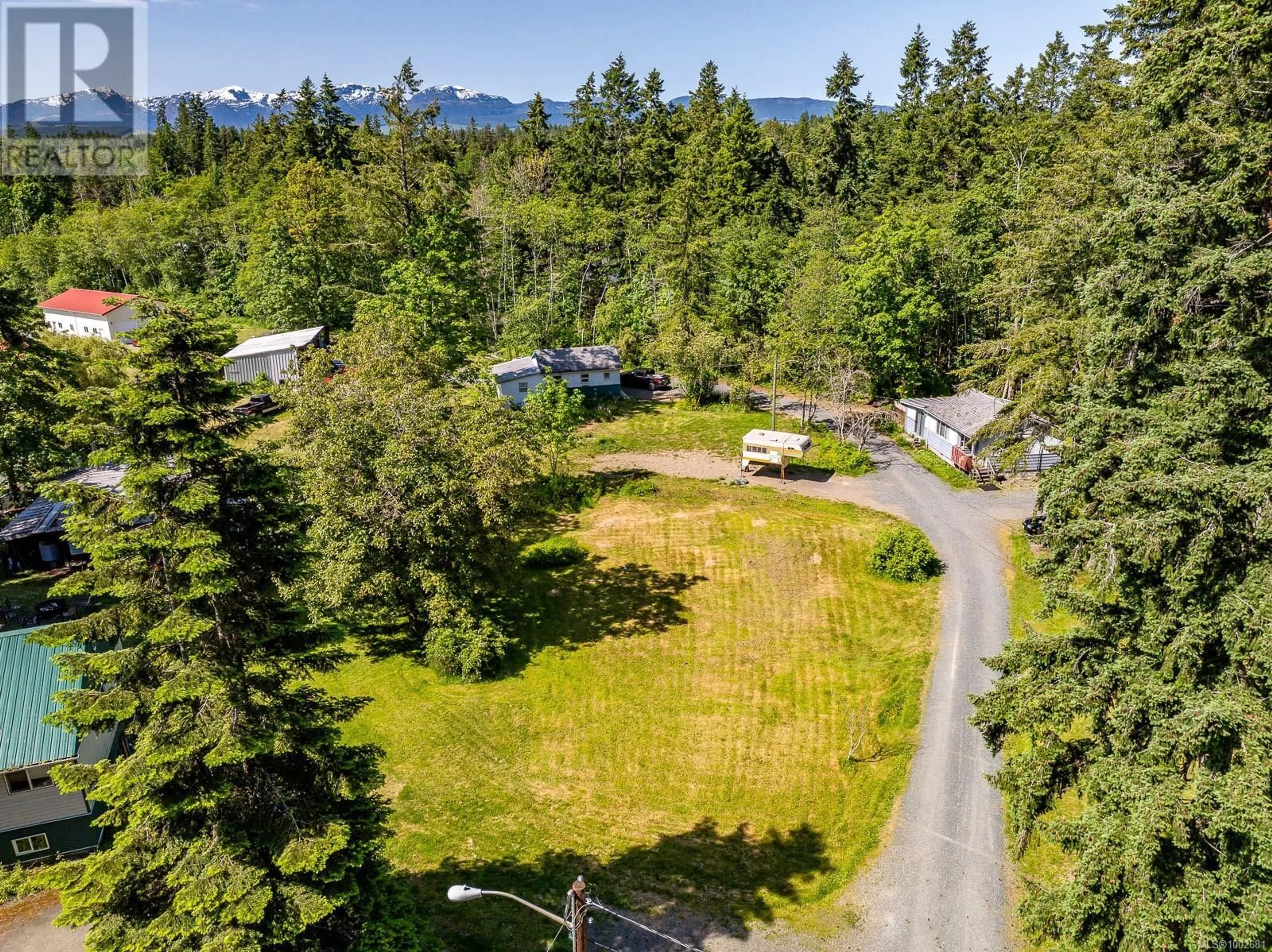 A pic from outside/outdoor area/front of a property/back of a property/a pic from drone, forest/trees view for 4399 ISLAND HIGHWAY SOUTH, Courtenay British Columbia V9N9T1