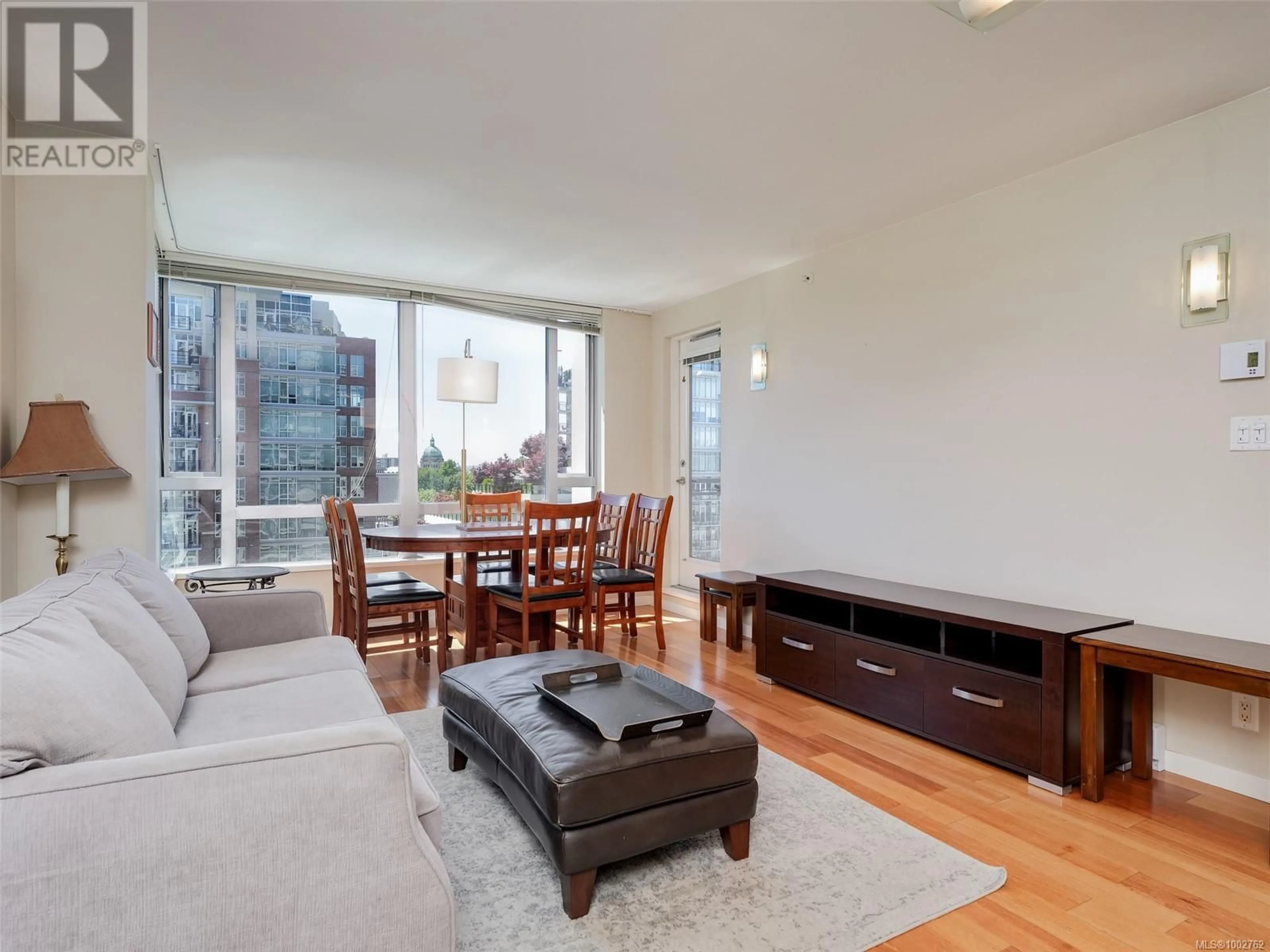 Living room with furniture, wood/laminate floor for 608 - 751 FAIRFIELD ROAD, Victoria British Columbia V8W4A4
