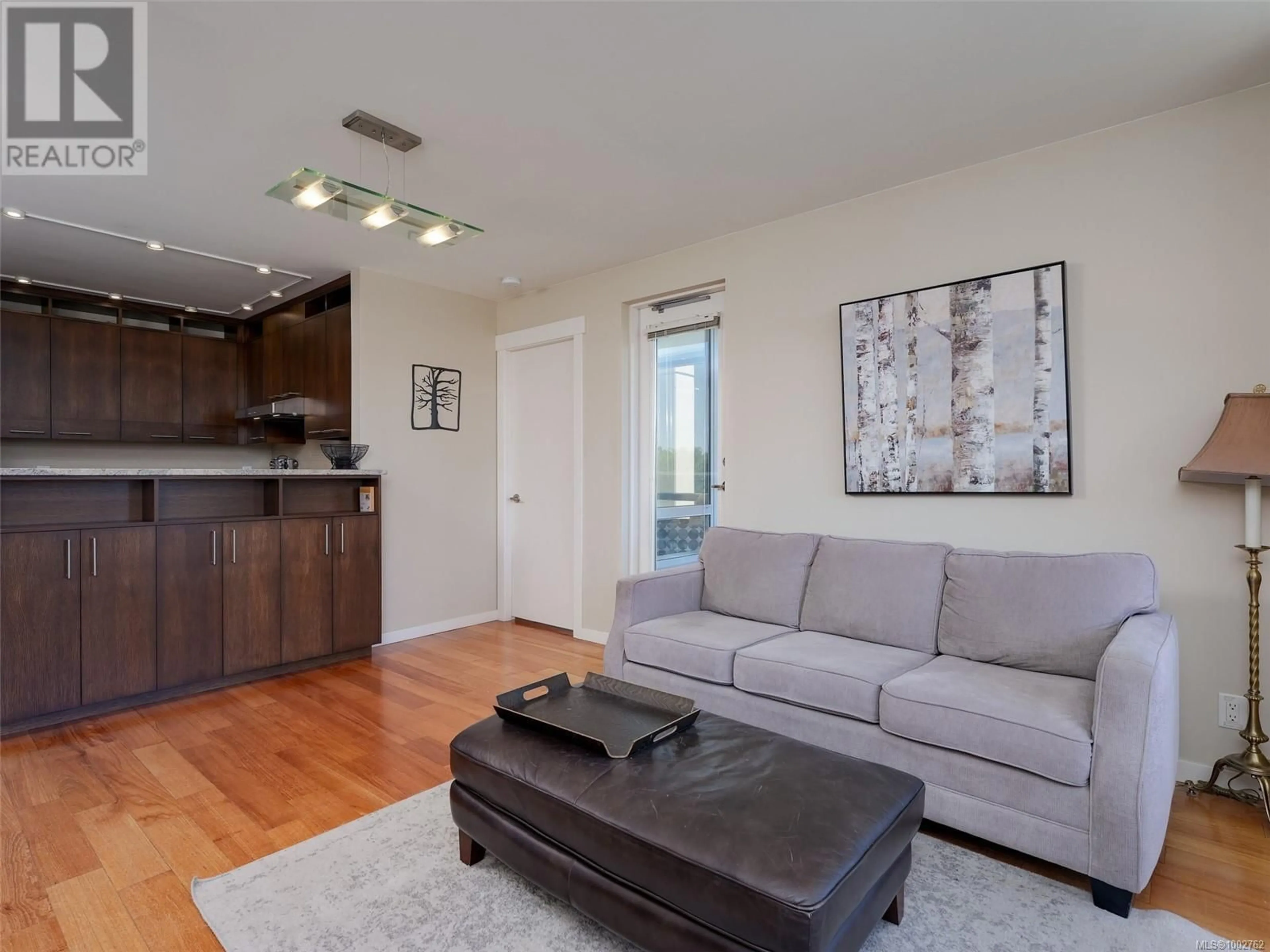 Living room with furniture, wood/laminate floor for 608 - 751 FAIRFIELD ROAD, Victoria British Columbia V8W4A4