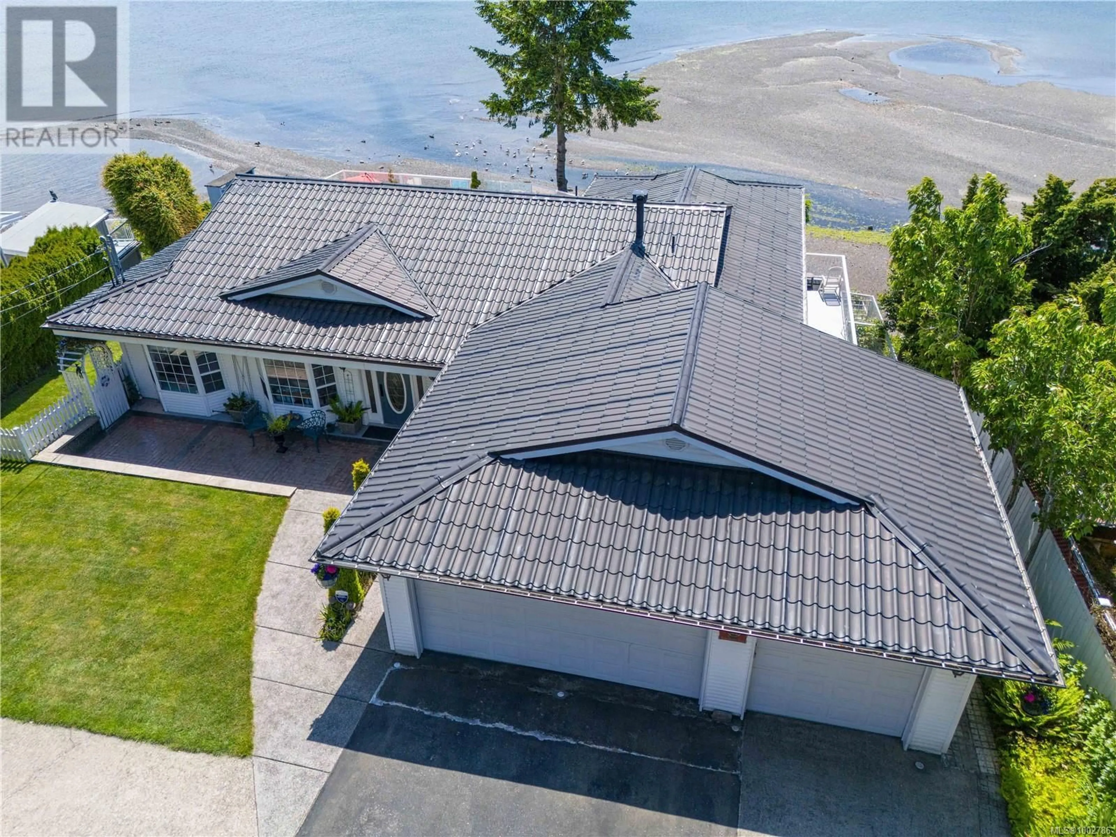A pic from outside/outdoor area/front of a property/back of a property/a pic from drone, water/lake/river/ocean view for 2920 HAMMOND BAY ROAD, Nanaimo British Columbia V9T1E2