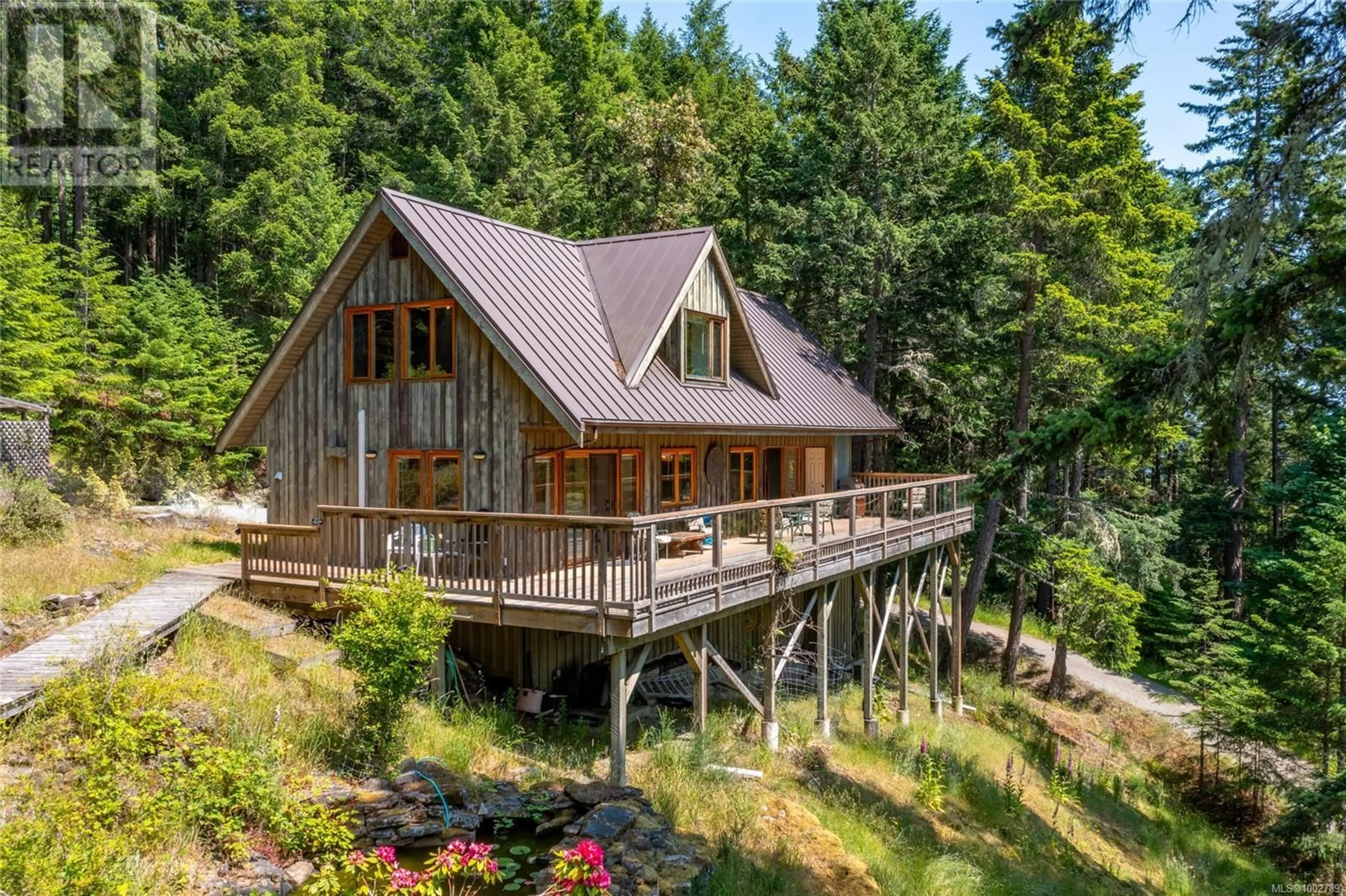 A pic from outside/outdoor area/front of a property/back of a property/a pic from drone, water/lake/river/ocean view for 3350 PORT WASHINGTON ROAD, Pender Island British Columbia V0N2M1