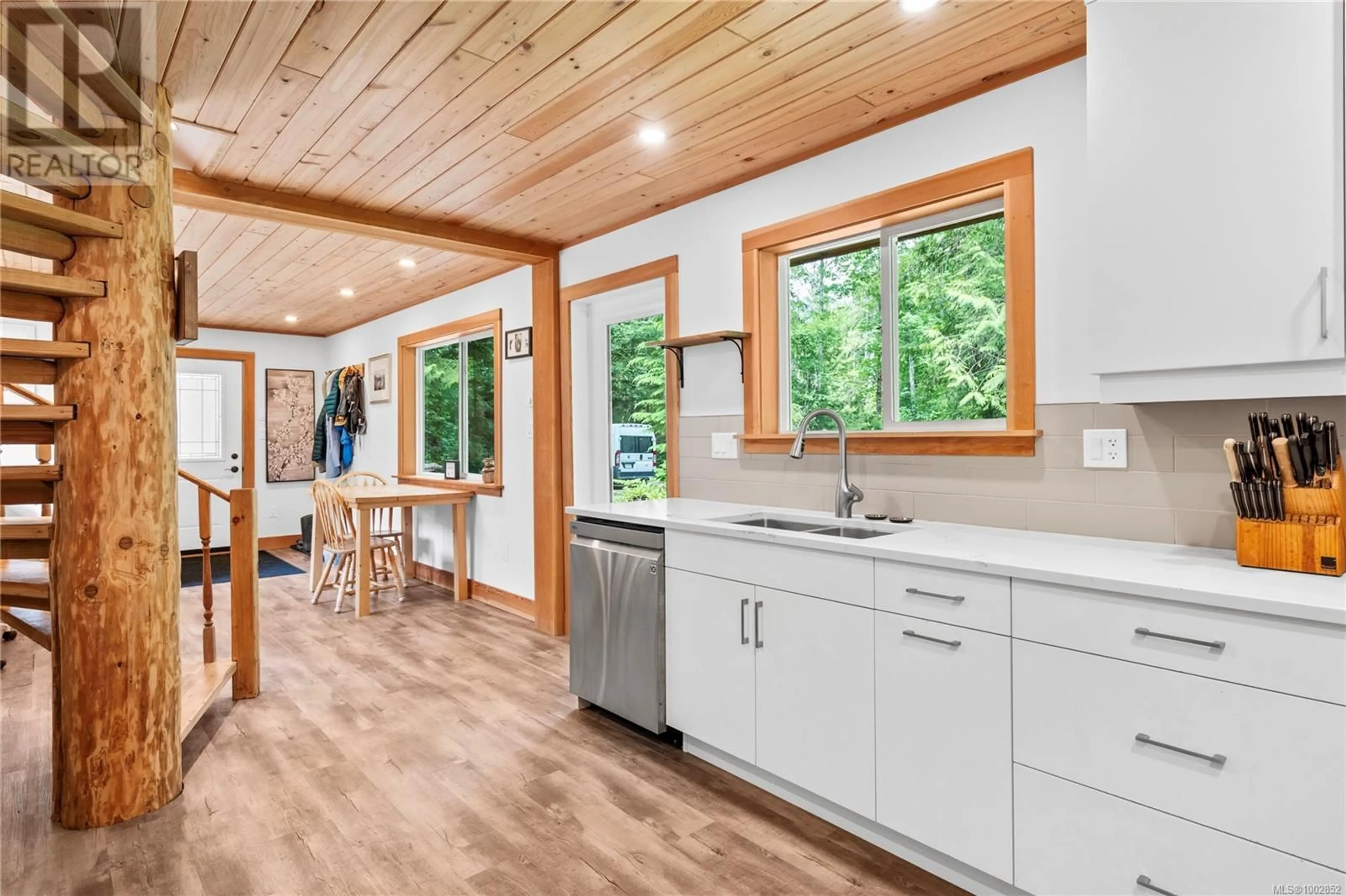 Open concept kitchen, wood/laminate floor for 1186 CHATSWORTH ROAD, Whiskey Creek British Columbia V9K1V6