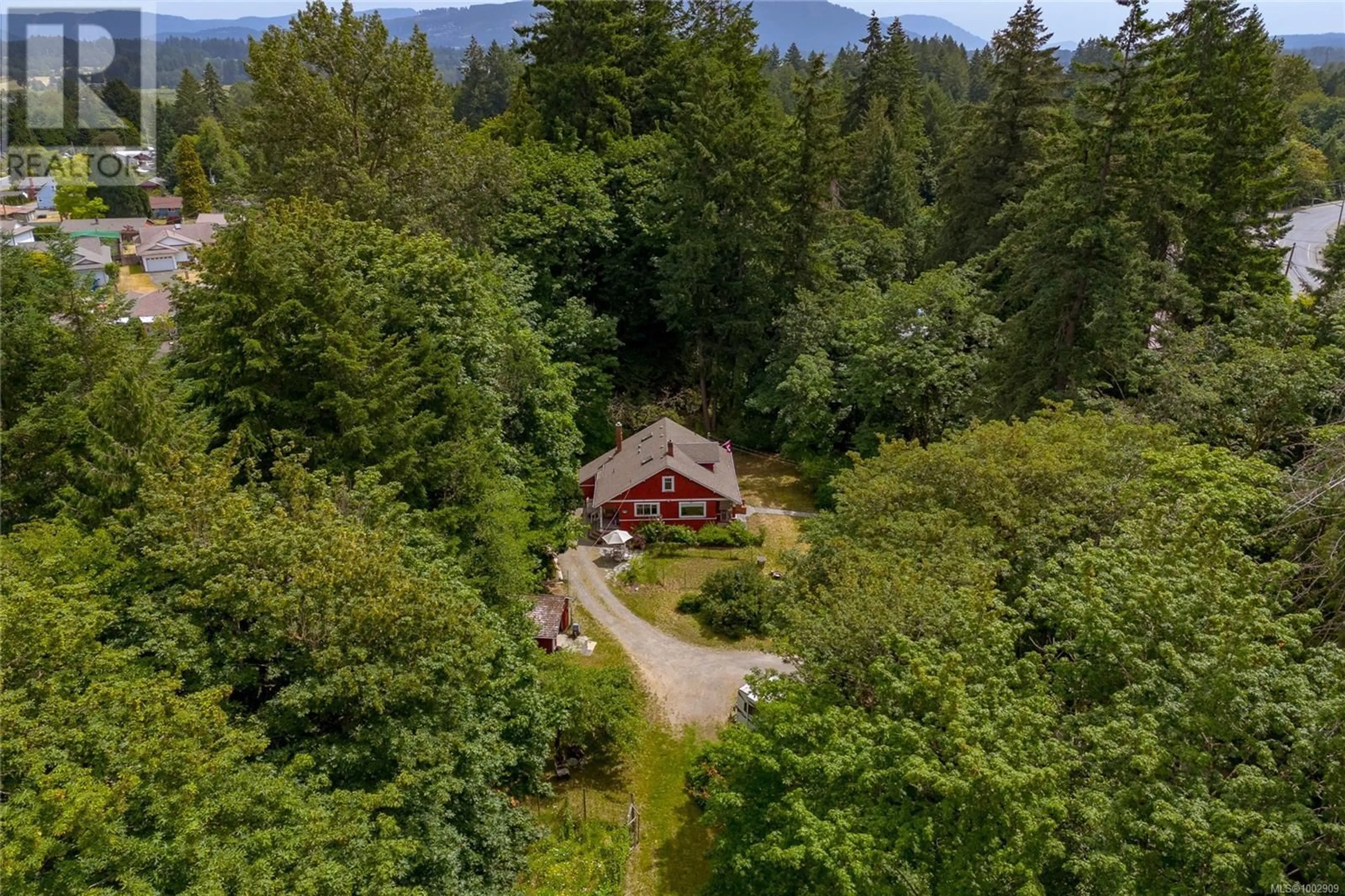 A pic from outside/outdoor area/front of a property/back of a property/a pic from drone, forest/trees view for 3065 COWICHAN LAKE ROAD, Duncan British Columbia V9L4B6