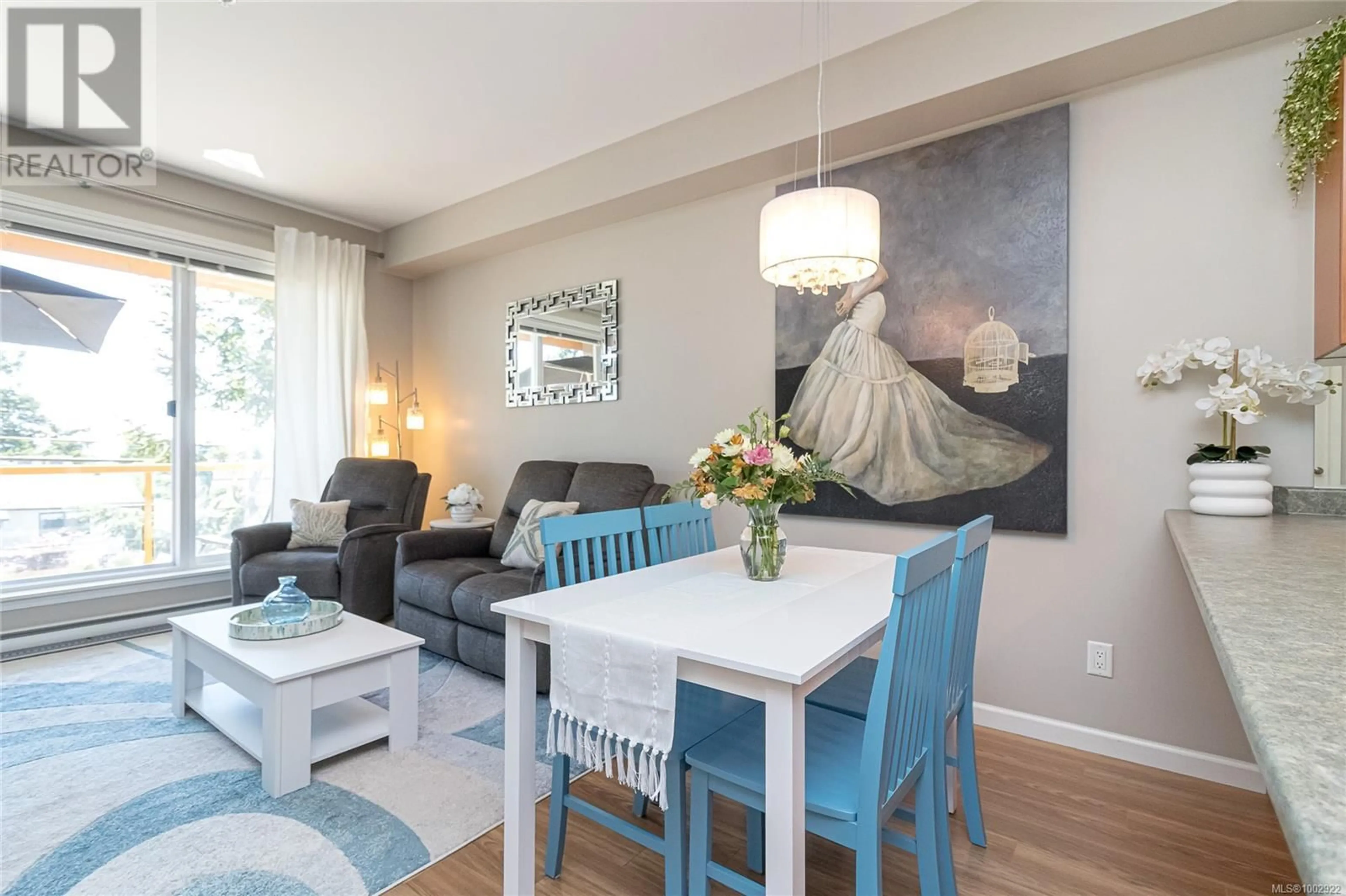 Living room with furniture, wood/laminate floor for 210 - 1959 POLO PARK COURT, Central Saanich British Columbia V8M2K1
