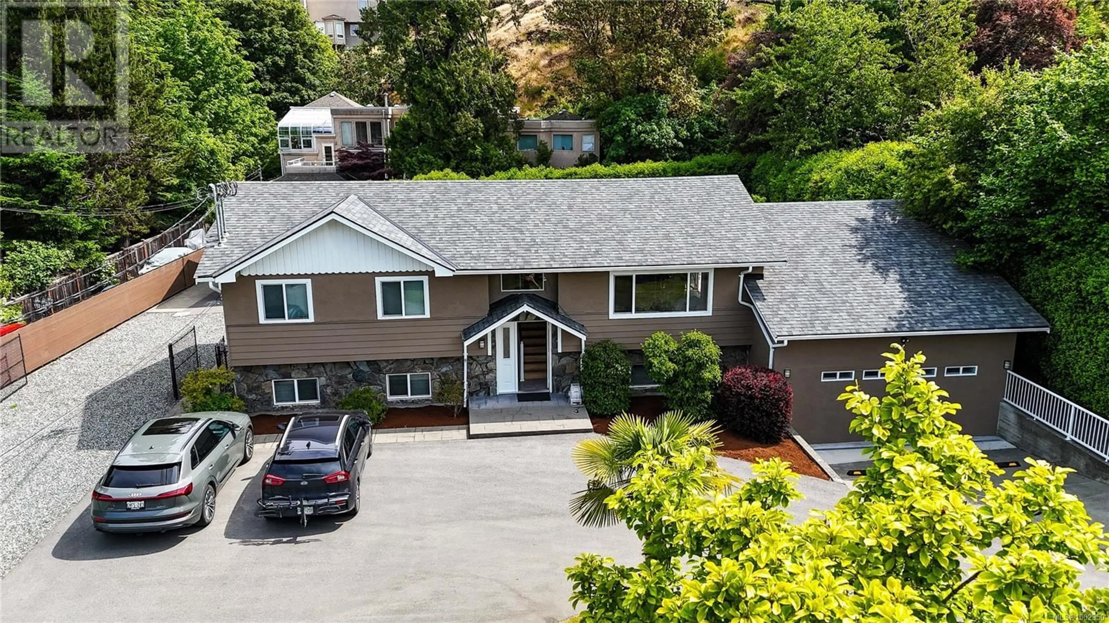 A pic from outside/outdoor area/front of a property/back of a property/a pic from drone, mountain view for 4767 CORDOVA BAY ROAD, Saanich British Columbia V8Y2J7