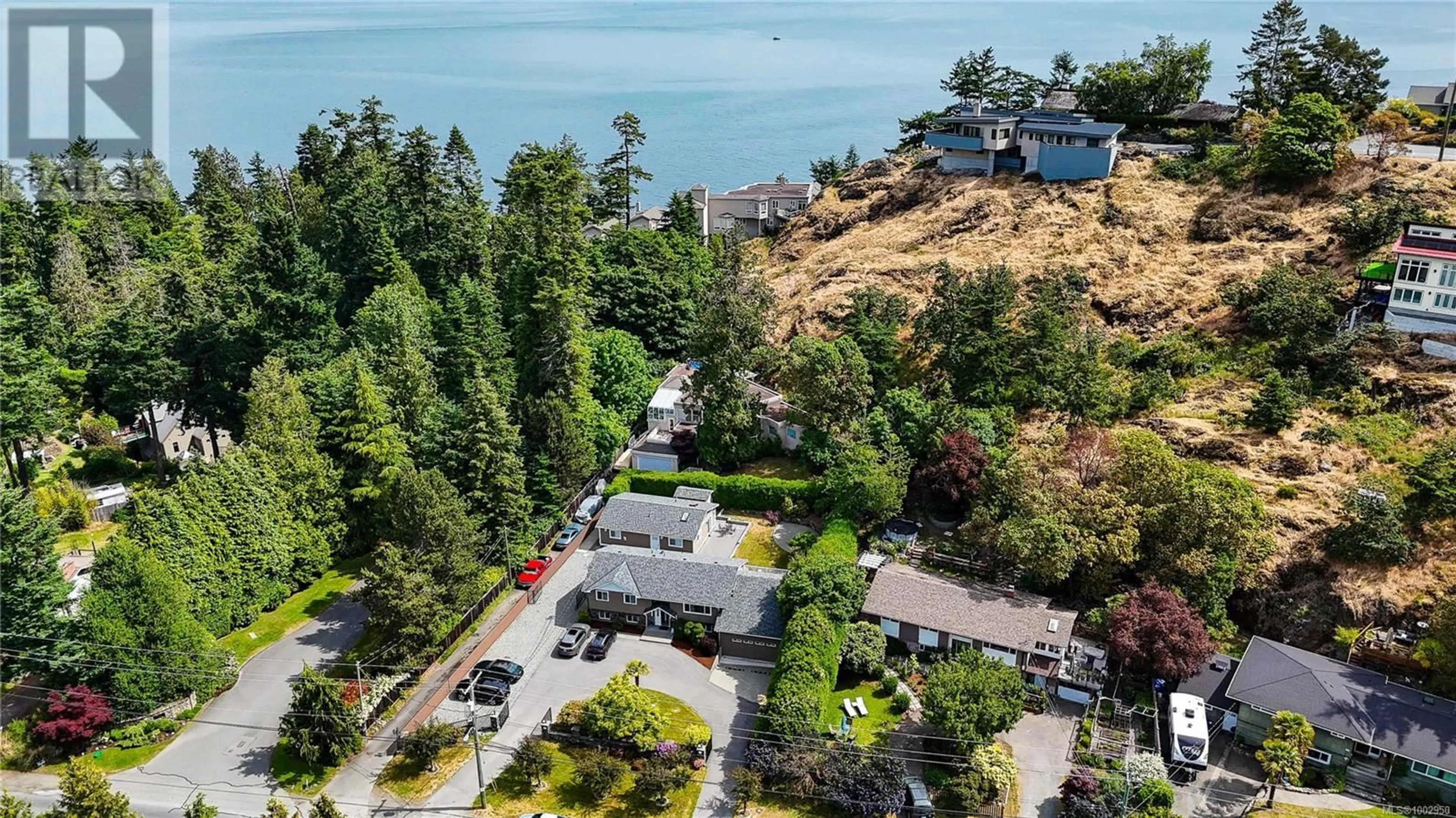 A pic from outside/outdoor area/front of a property/back of a property/a pic from drone, water/lake/river/ocean view for 4767 CORDOVA BAY ROAD, Saanich British Columbia V8Y2J7