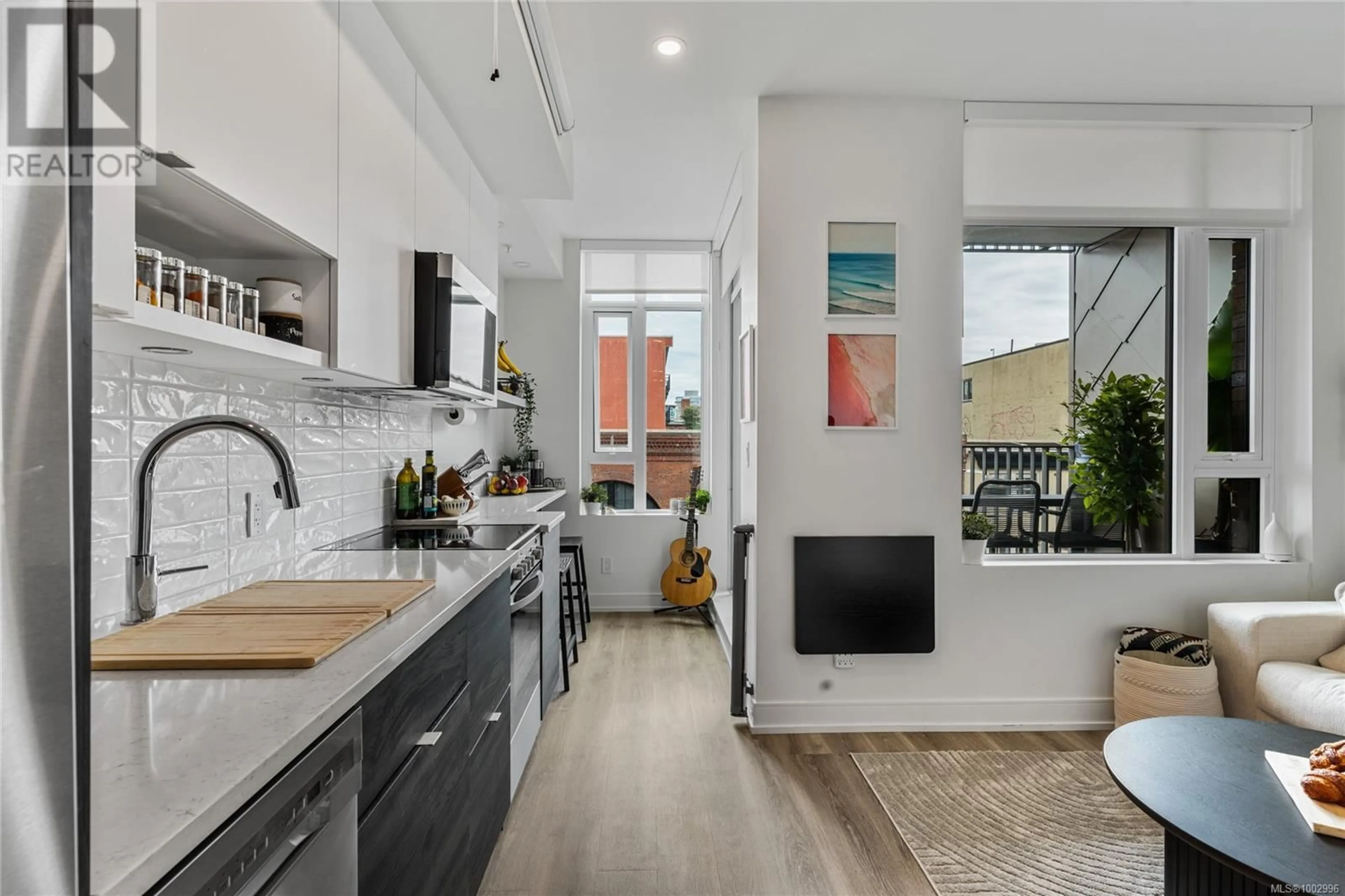 Open concept kitchen, ceramic/tile floor for 702 - 1628 STORE STREET, Victoria British Columbia V8W0H1