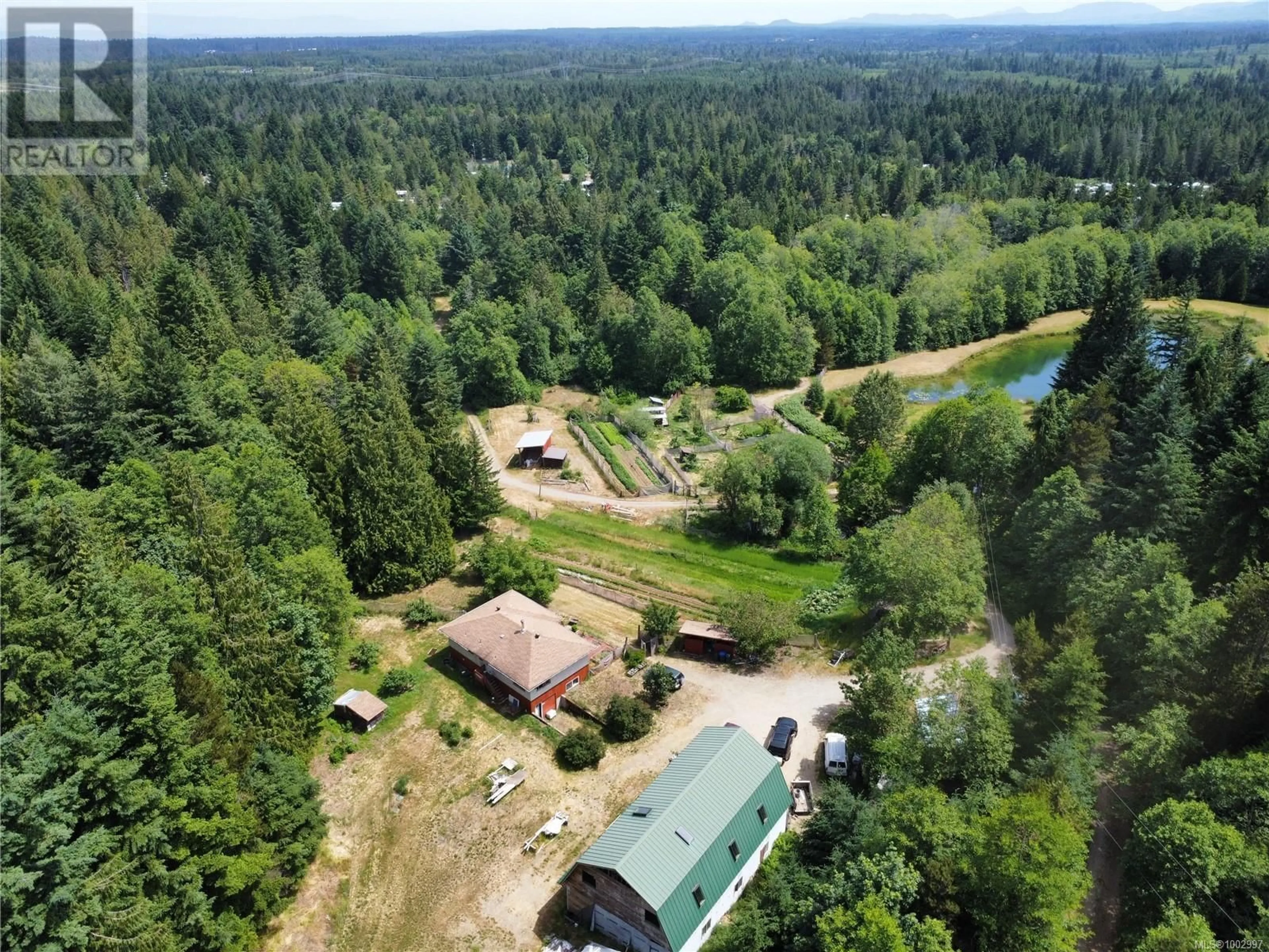 A pic from outside/outdoor area/front of a property/back of a property/a pic from drone, forest/trees view for 1075 SPIDER LAKE ROAD, Qualicum Beach British Columbia V9K2L7