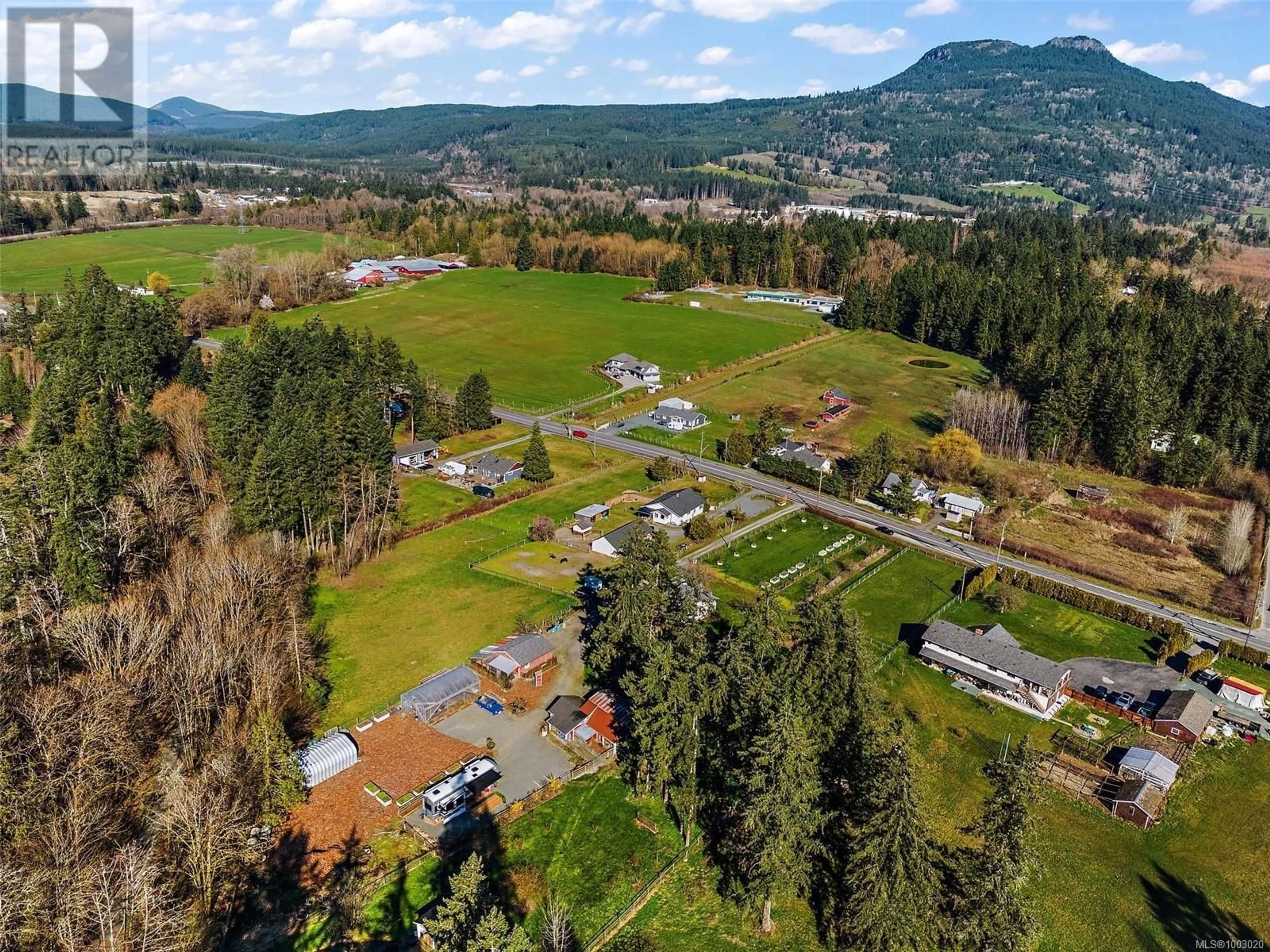 A pic from outside/outdoor area/front of a property/back of a property/a pic from drone, mountain view for 3574 COWICHAN LAKE ROAD, Duncan British Columbia V9L6K5